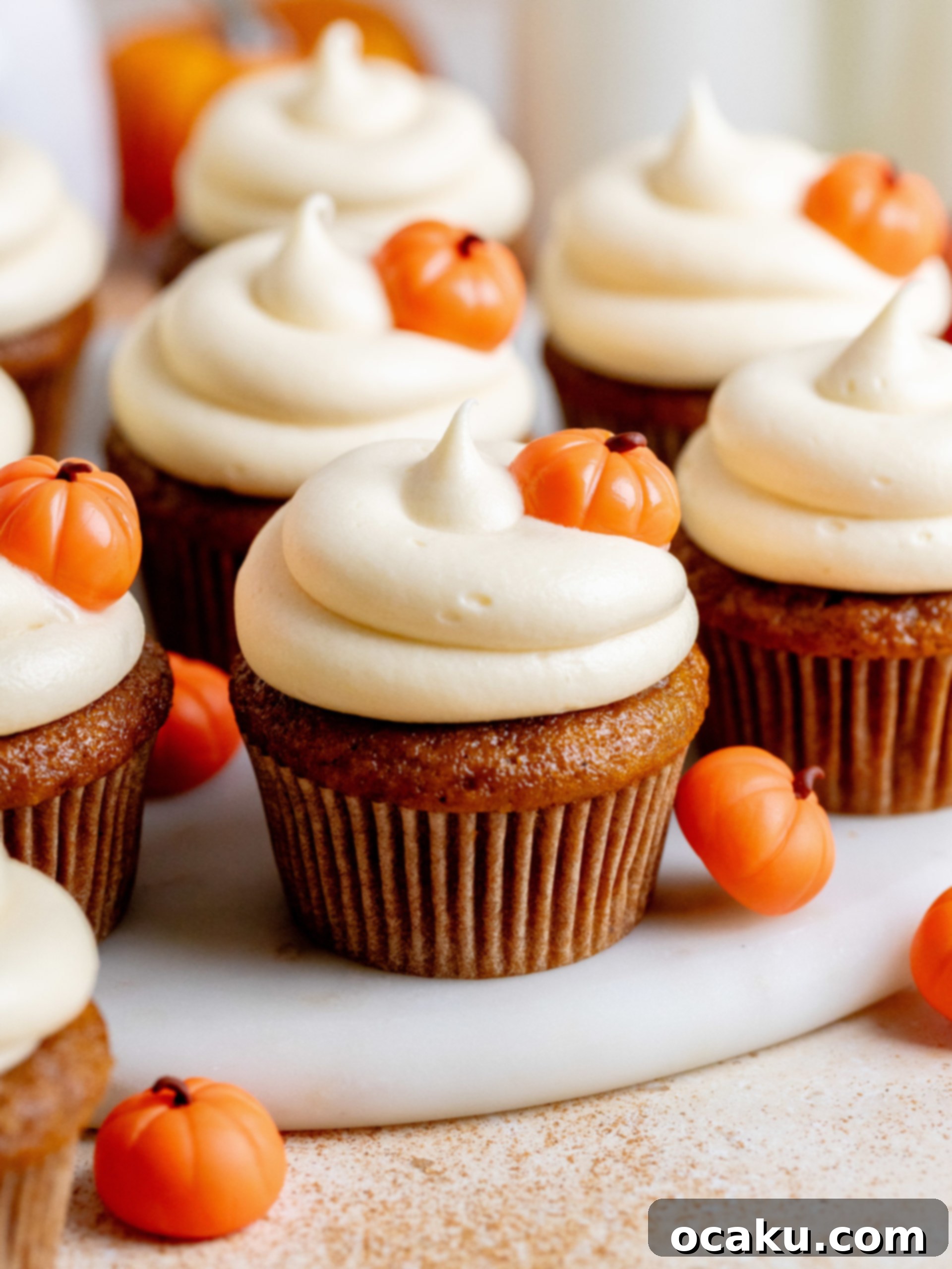 A perfectly frosted pumpkin cupcake, ready to be enjoyed.