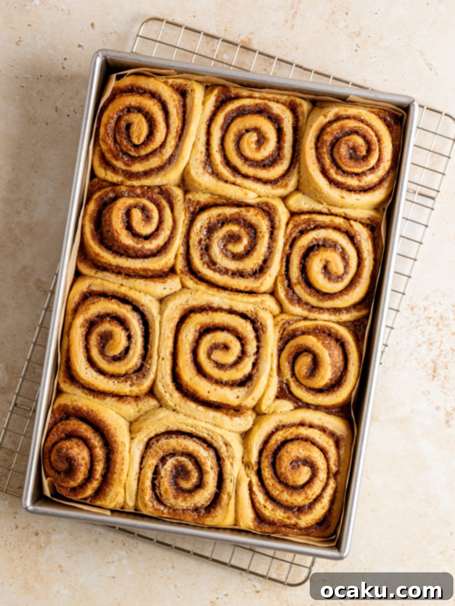 Freshly frosted pumpkin cinnamon rolls.
