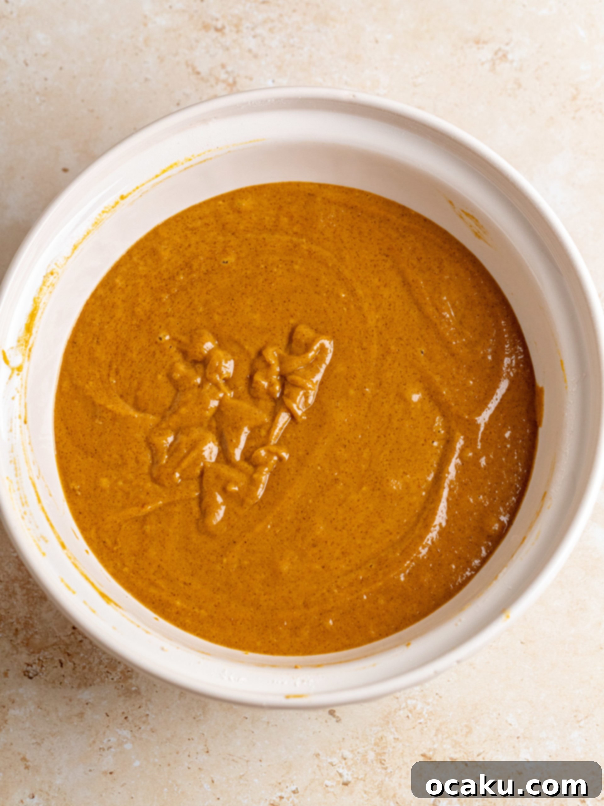 Creaming butter in a stand mixer for cinnamon cream cheese frosting