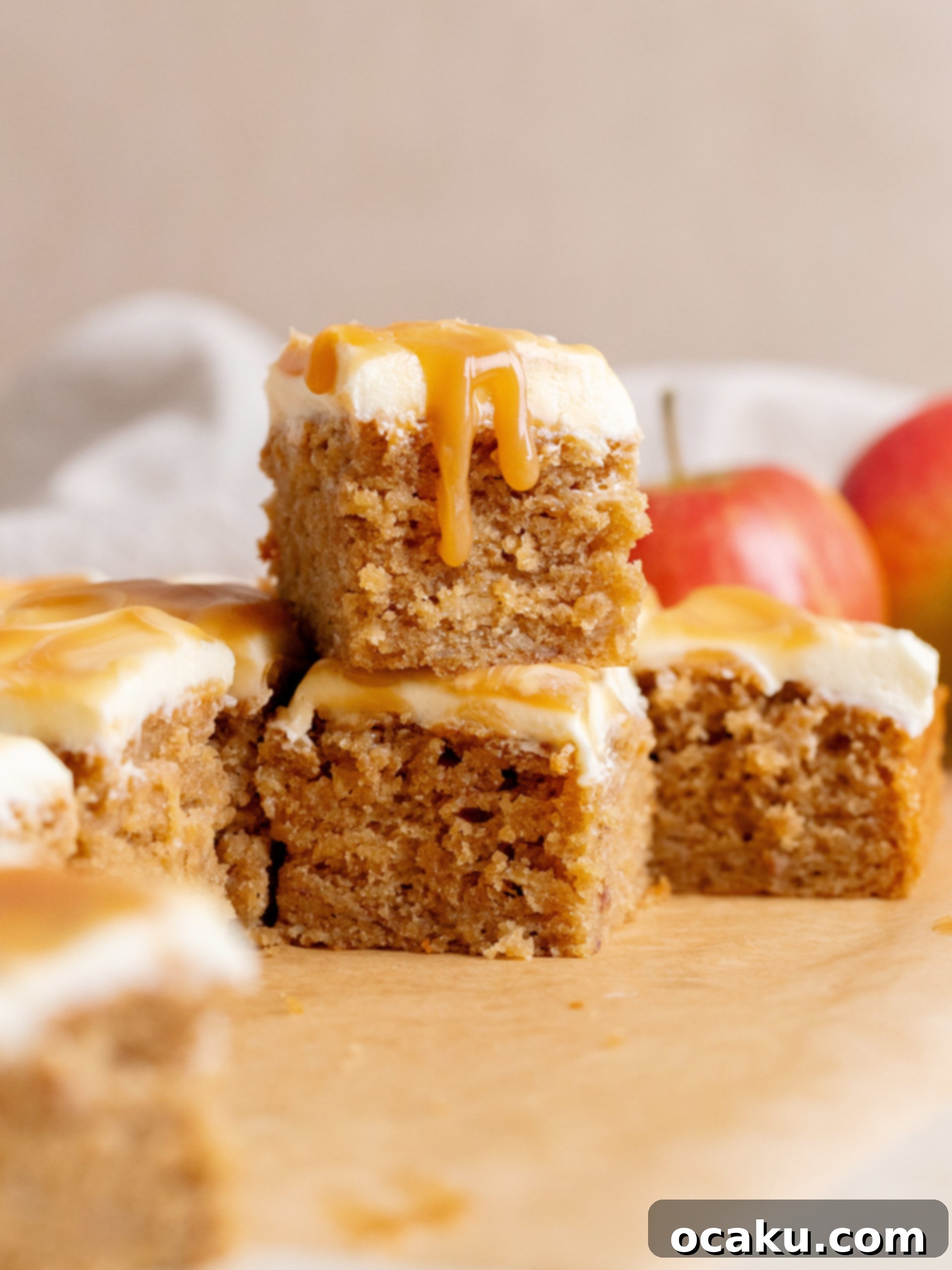 A delectable slice of Caramel Apple Cake, showcasing the moist interior, creamy frosting, and luscious caramel drizzle ready to be enjoyed.