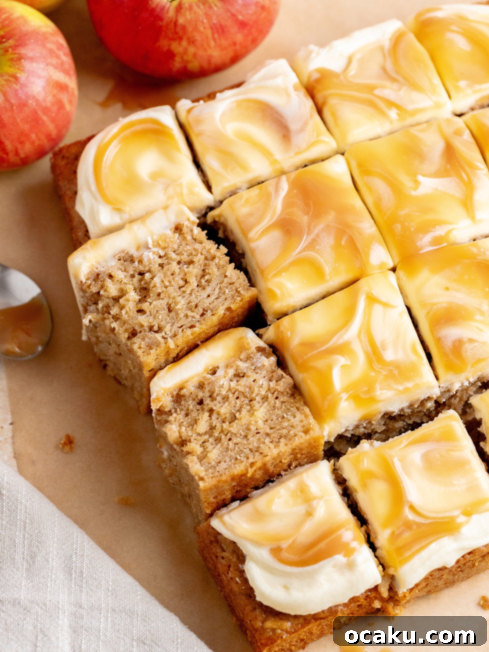 A close-up of a delightful slice of Caramel Apple Cake, showing the moist cake layers, creamy buttercream, and rich caramel drizzle.