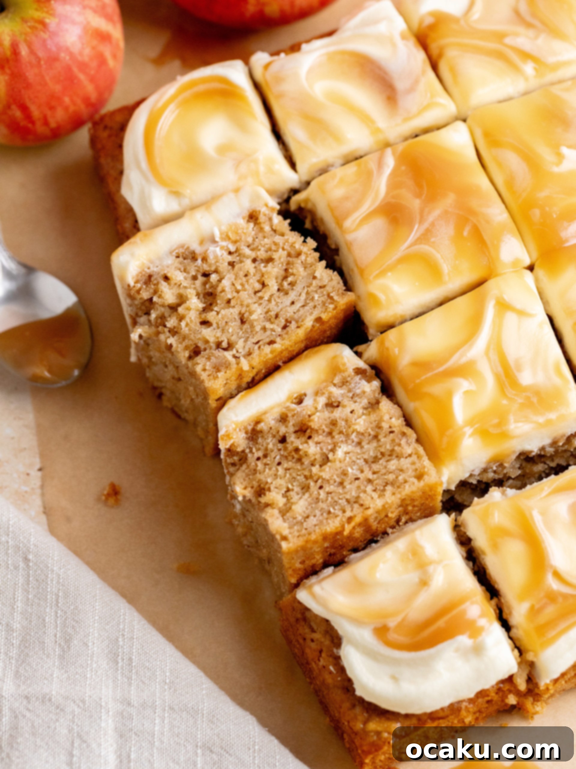 Close-up of the moist apple cake texture with visible apple pieces, showcasing the deliciousness of the Caramel Apple Cake.