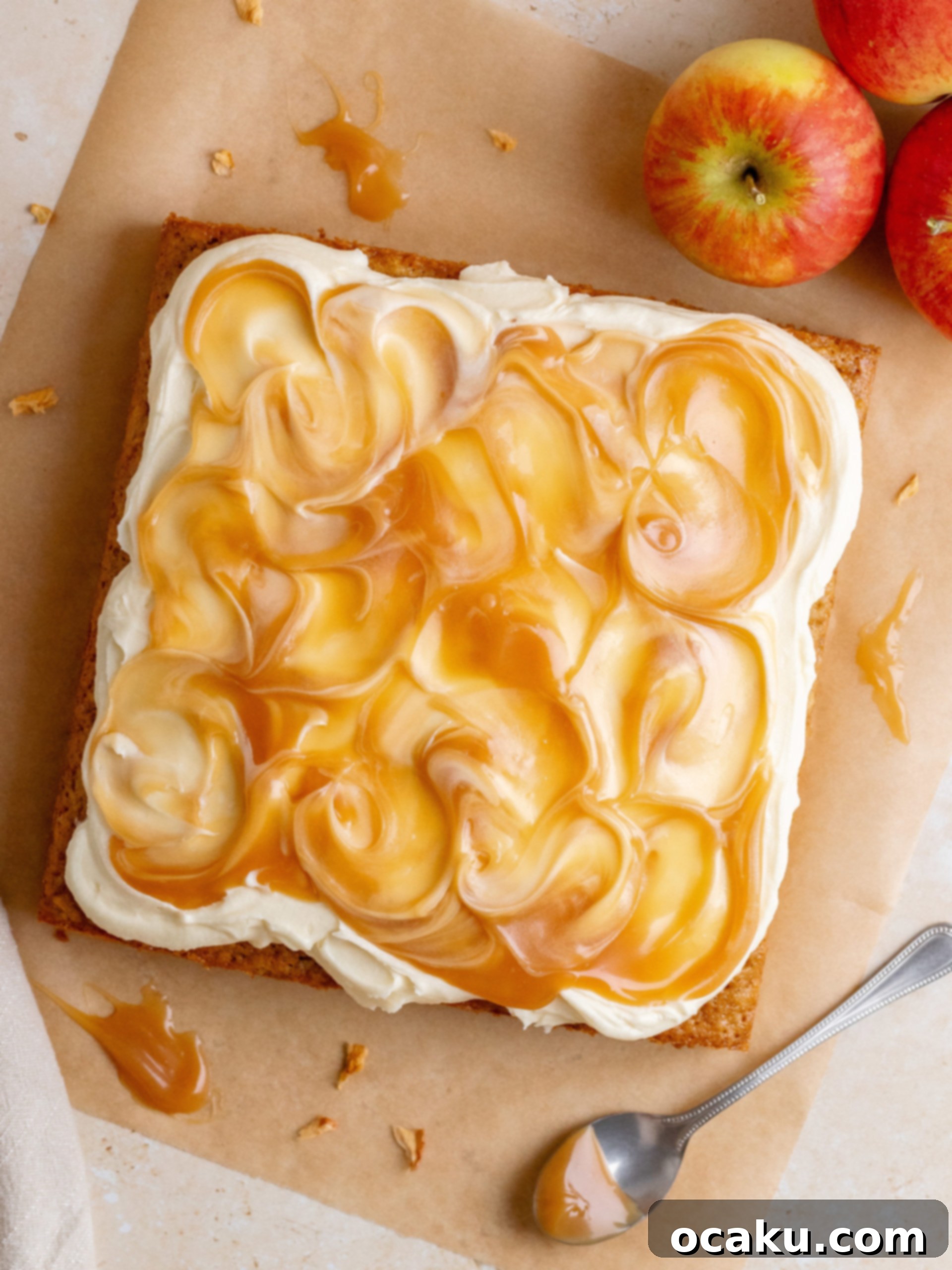 The stunning finished Caramel Apple Cake, beautifully decorated with artistic swirls of caramel sauce, ready to be served.