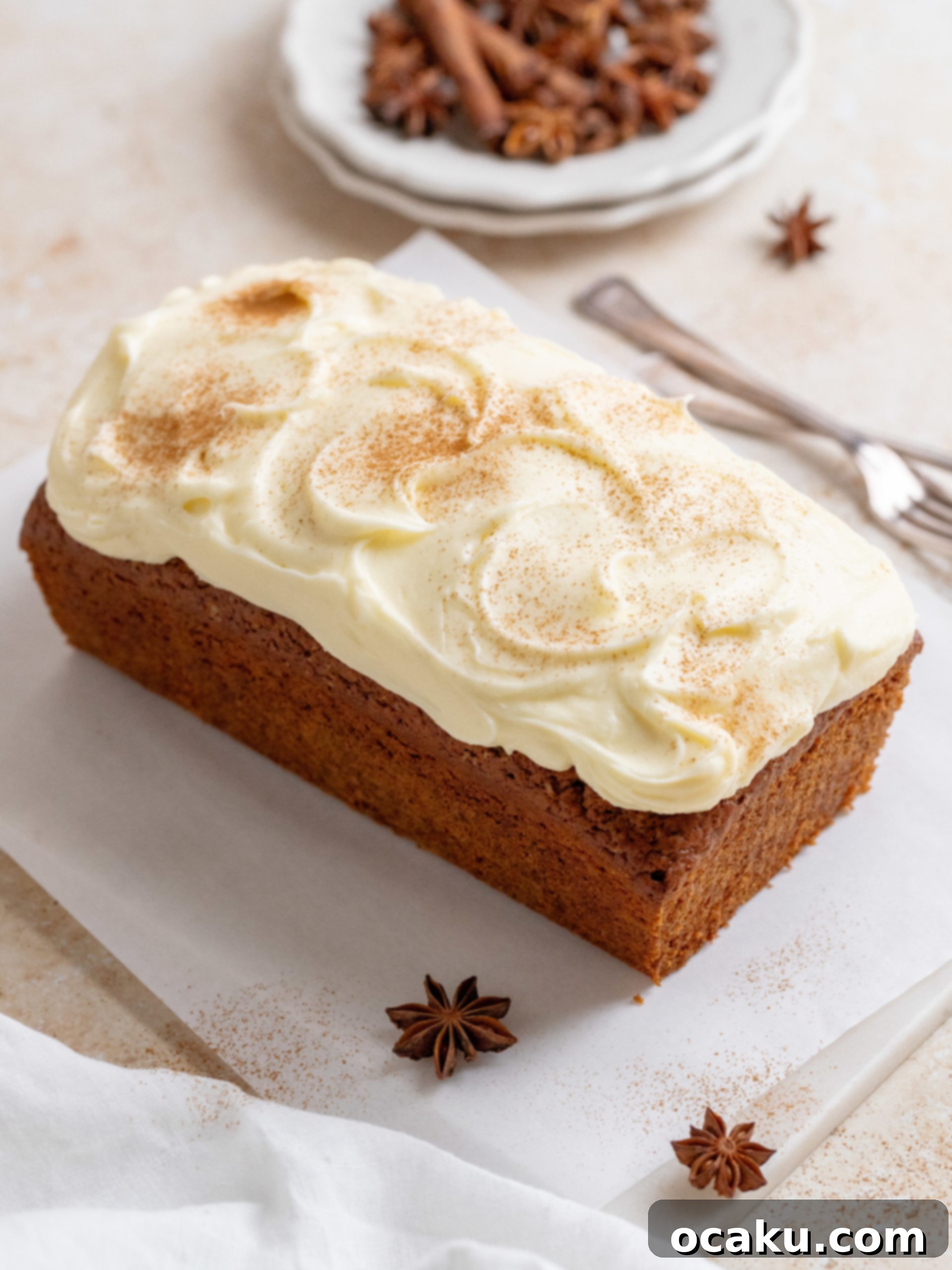A full loaf of sweet potato bread, frosted and beautifully presented.