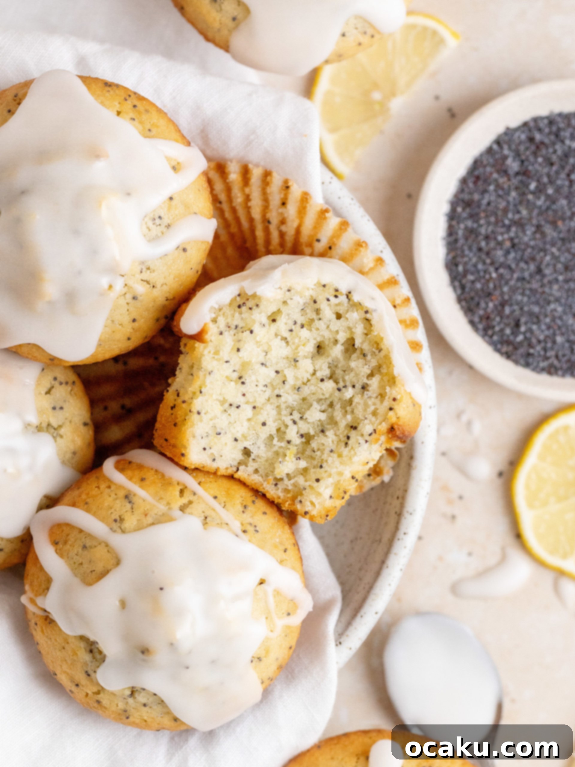 Close-up of a perfectly baked Lemon Poppy Seed Muffin with lemon glaze.