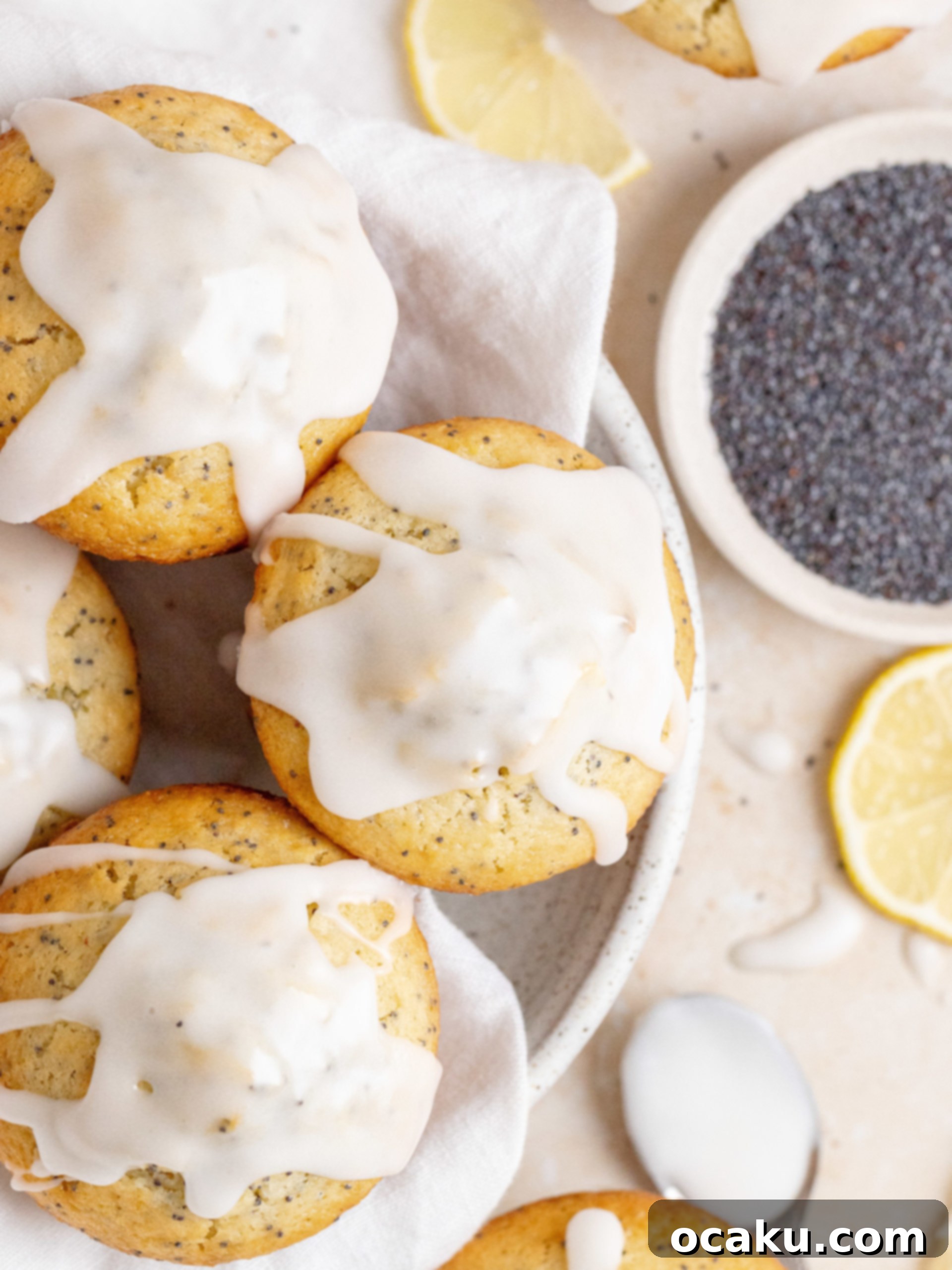 Close-up of baked Lemon Poppy Seed Muffins cooling on a wire rack.