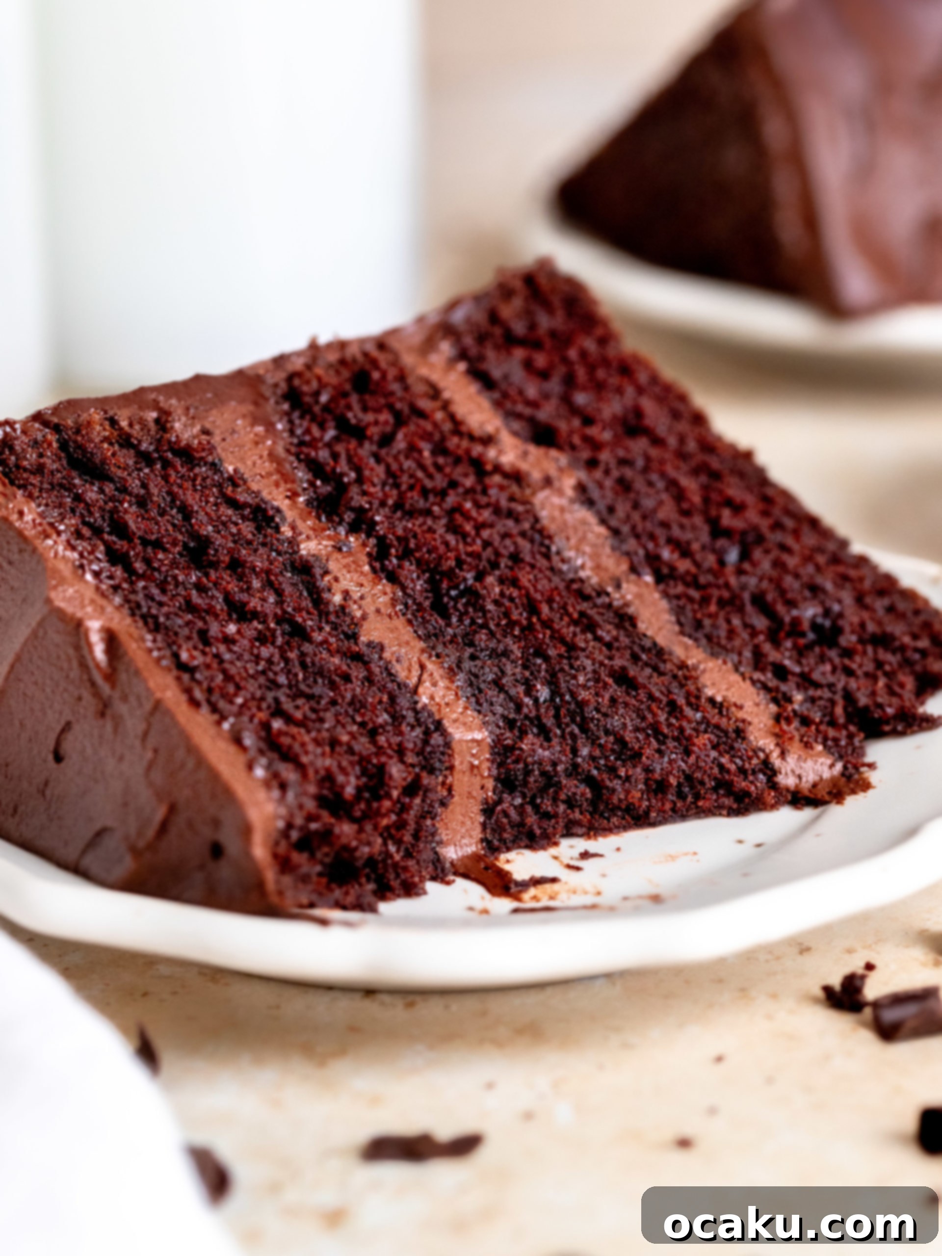 Matilda's Irresistibly Moist Cake 6 A freshly frosted Matilda's chocolate cake on a cake stand, ready for serving.