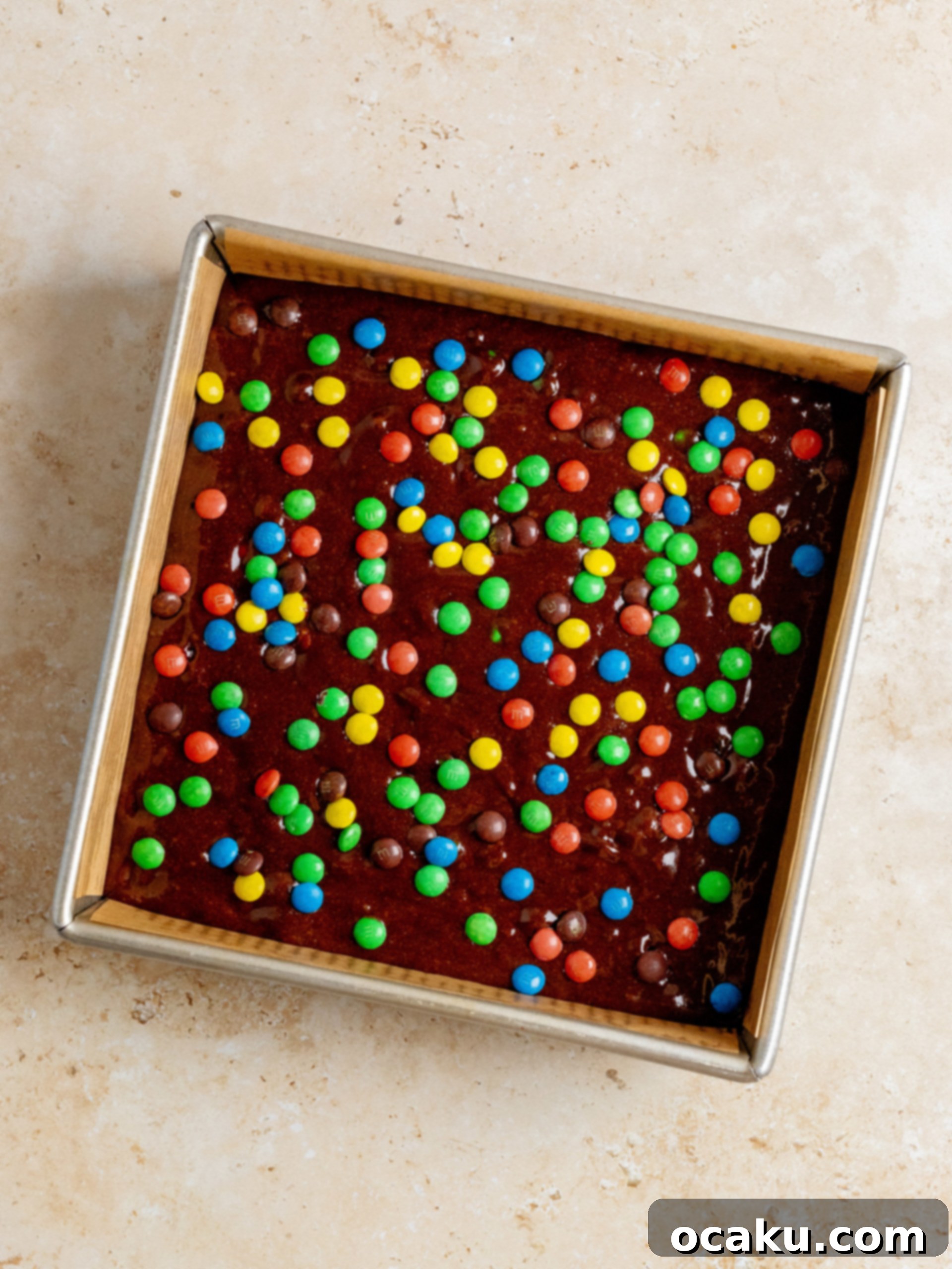 M&M Brownies 4 A bowl of dry ingredients for brownies, including flour, cocoa, and cornstarch, ready for mixing.