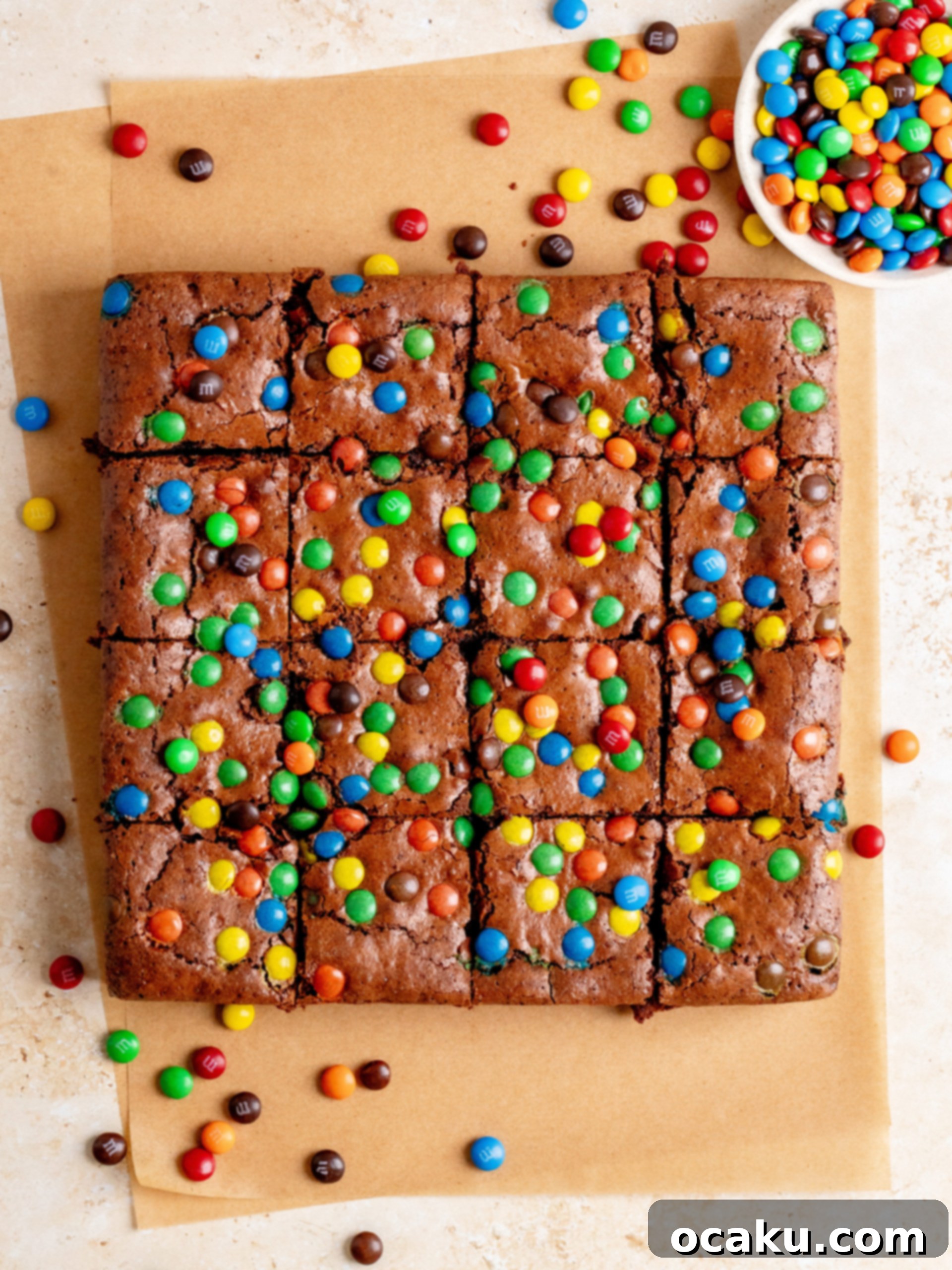 M&M Brownies 6 Freshly baked M&M brownies, cooling on a wire rack, ready to be cut into delicious slices.