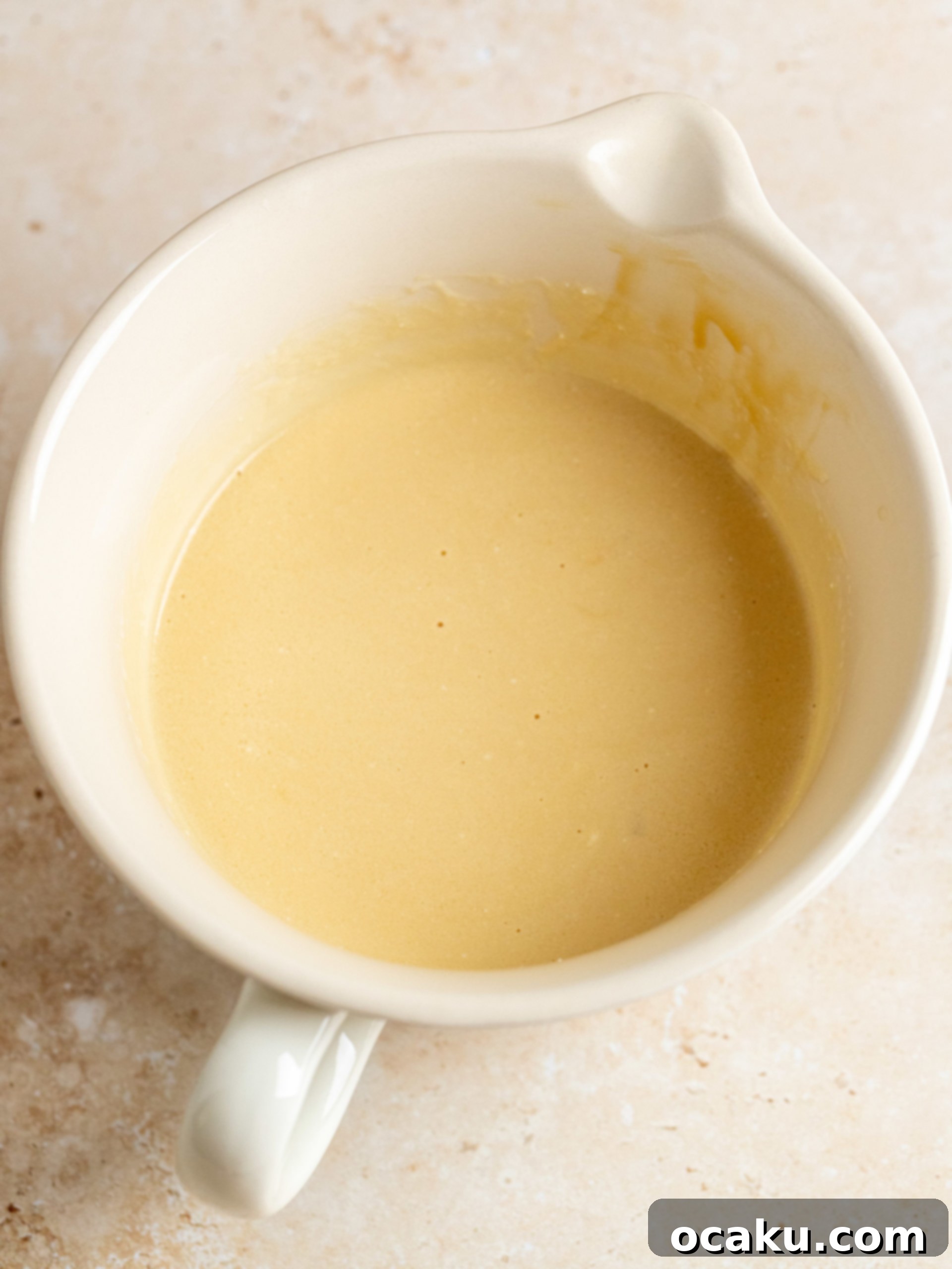 Step-by-step image of mixing wet ingredients.