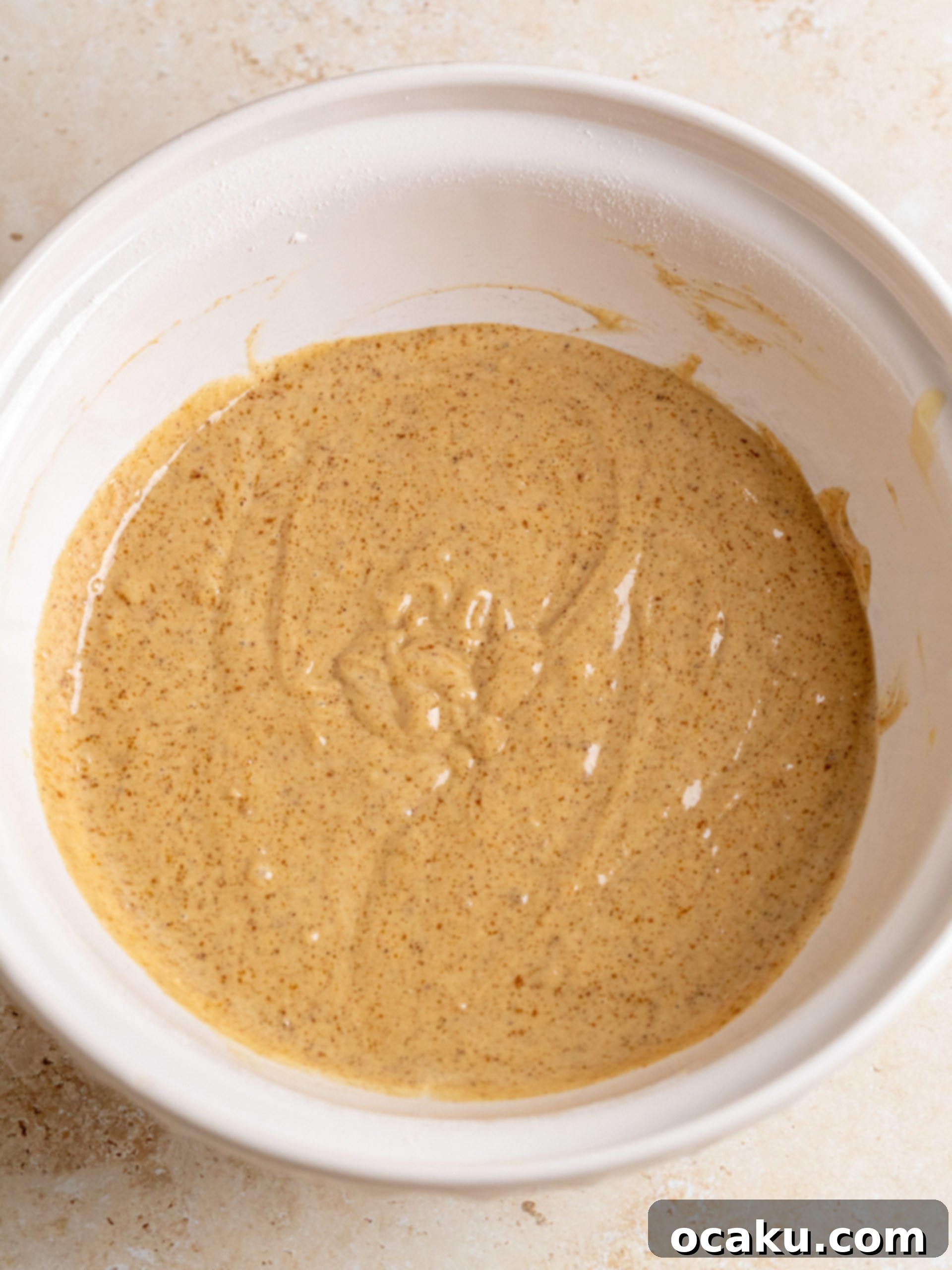 Step-by-step image of combining wet and dry ingredients.