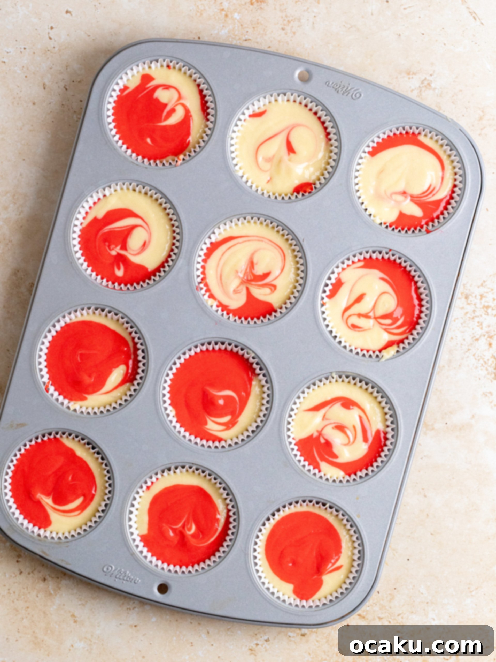 White chocolate peppermint frosting being piped onto a cupcake.