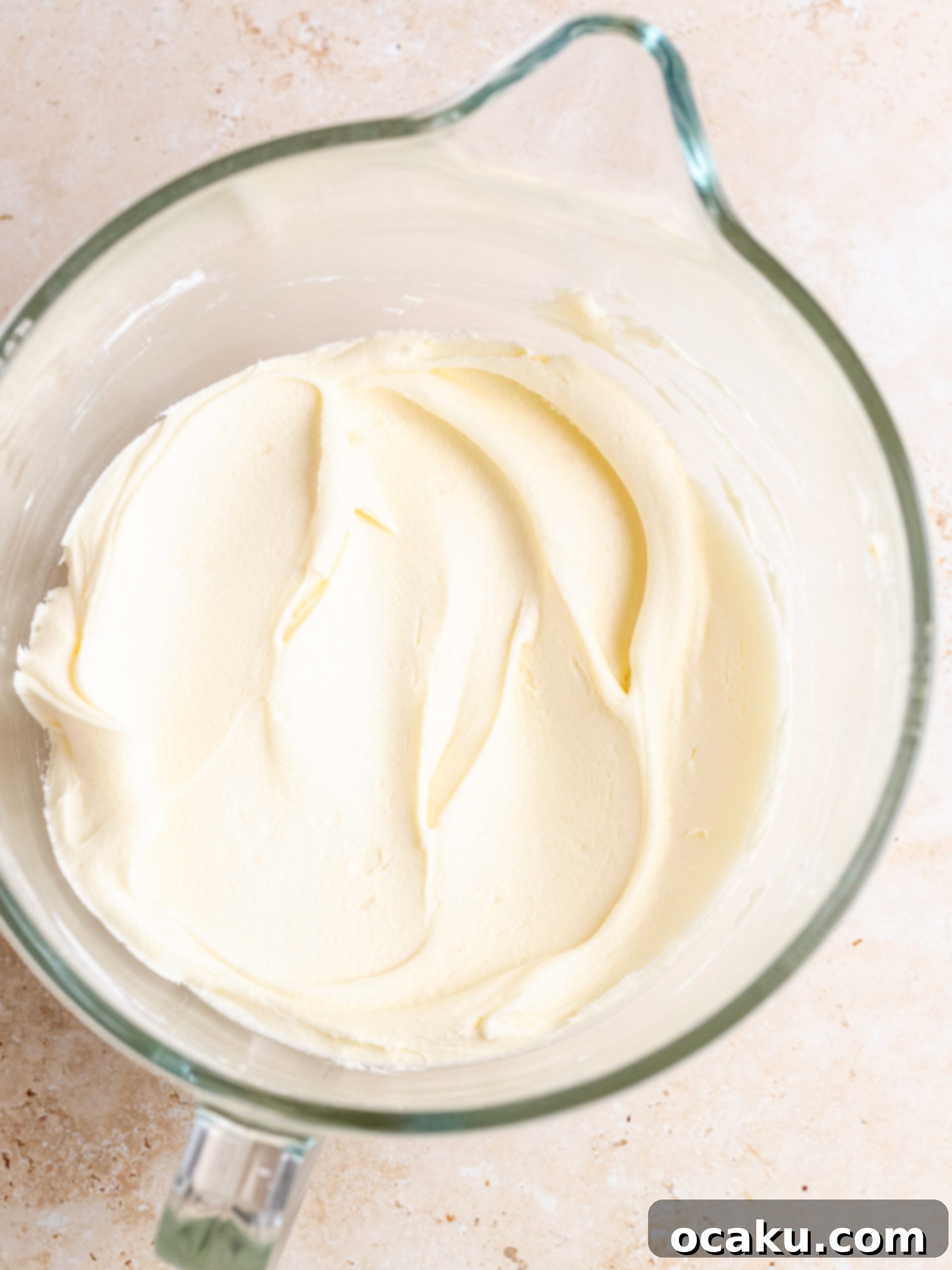 A row of white chocolate peppermint cupcakes on a cooling rack.