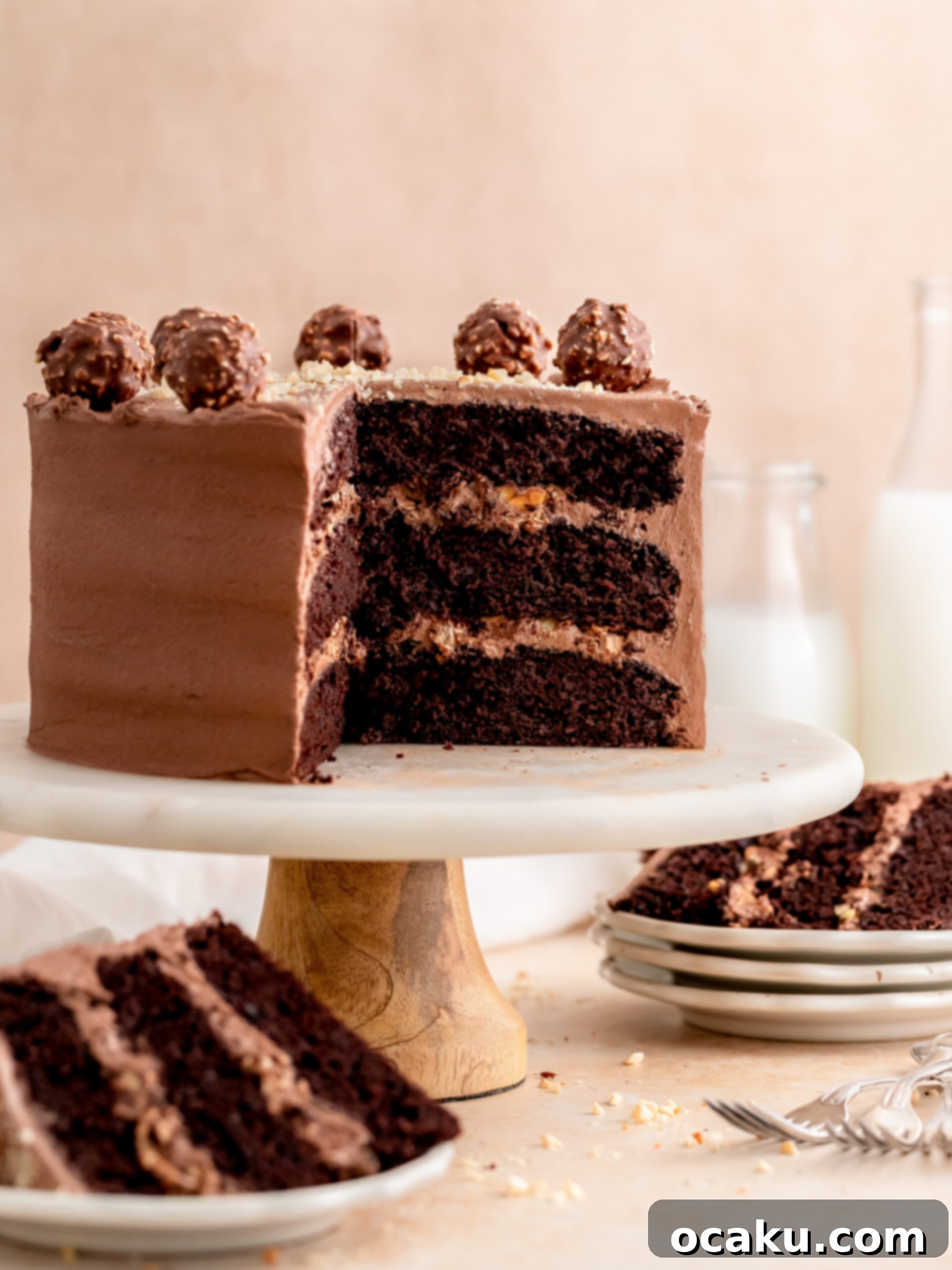 Aperol Spritz Cheesecake Close-up of the rich Nutella buttercream being spread on a chocolate cake layer.