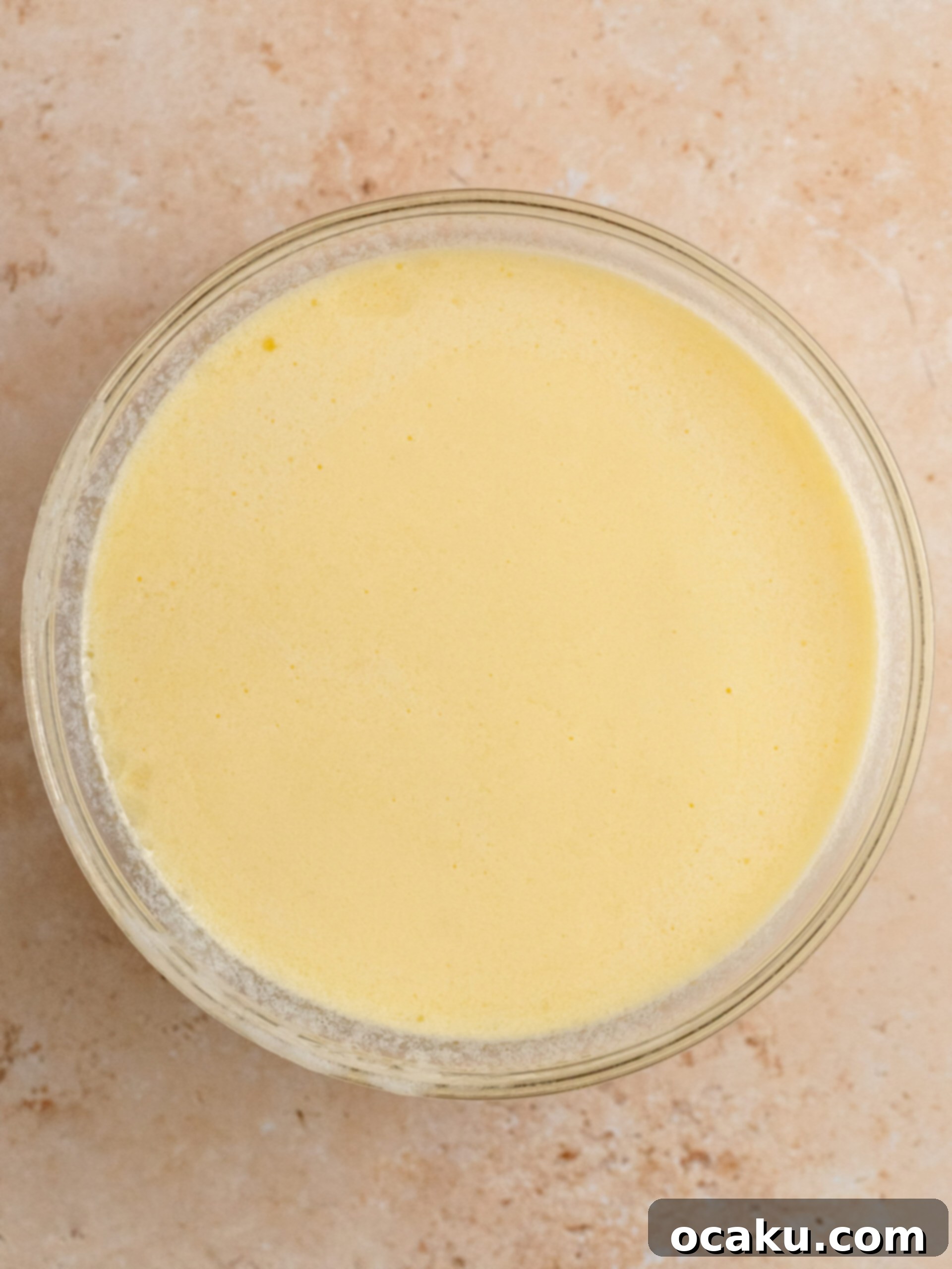 Ferrero Rocher Chocolate Hazelnut Cake 3 Dry ingredients for chocolate cake being sifted into a bowl.