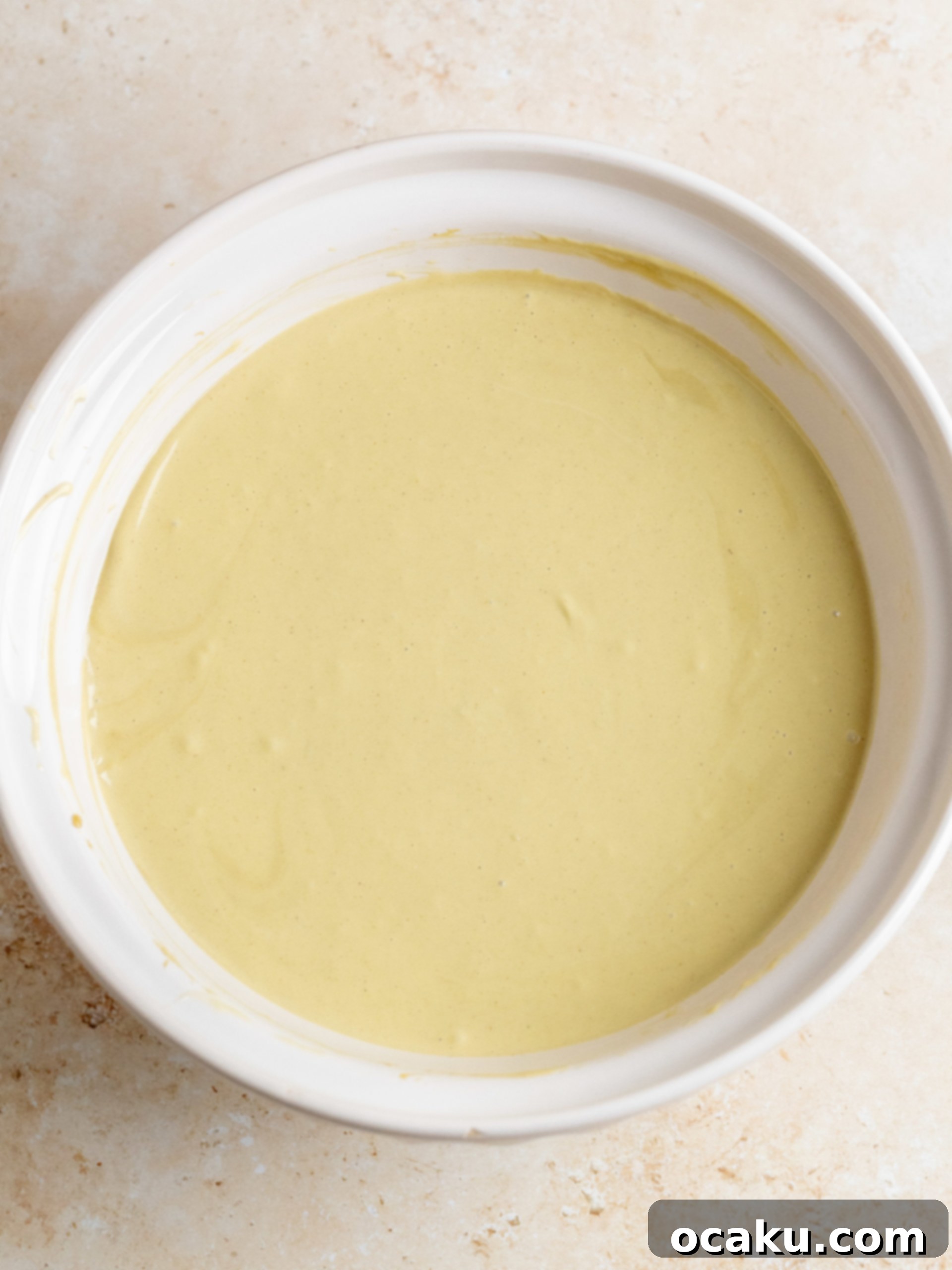 Pistachio cookie crust pressed into a springform pan