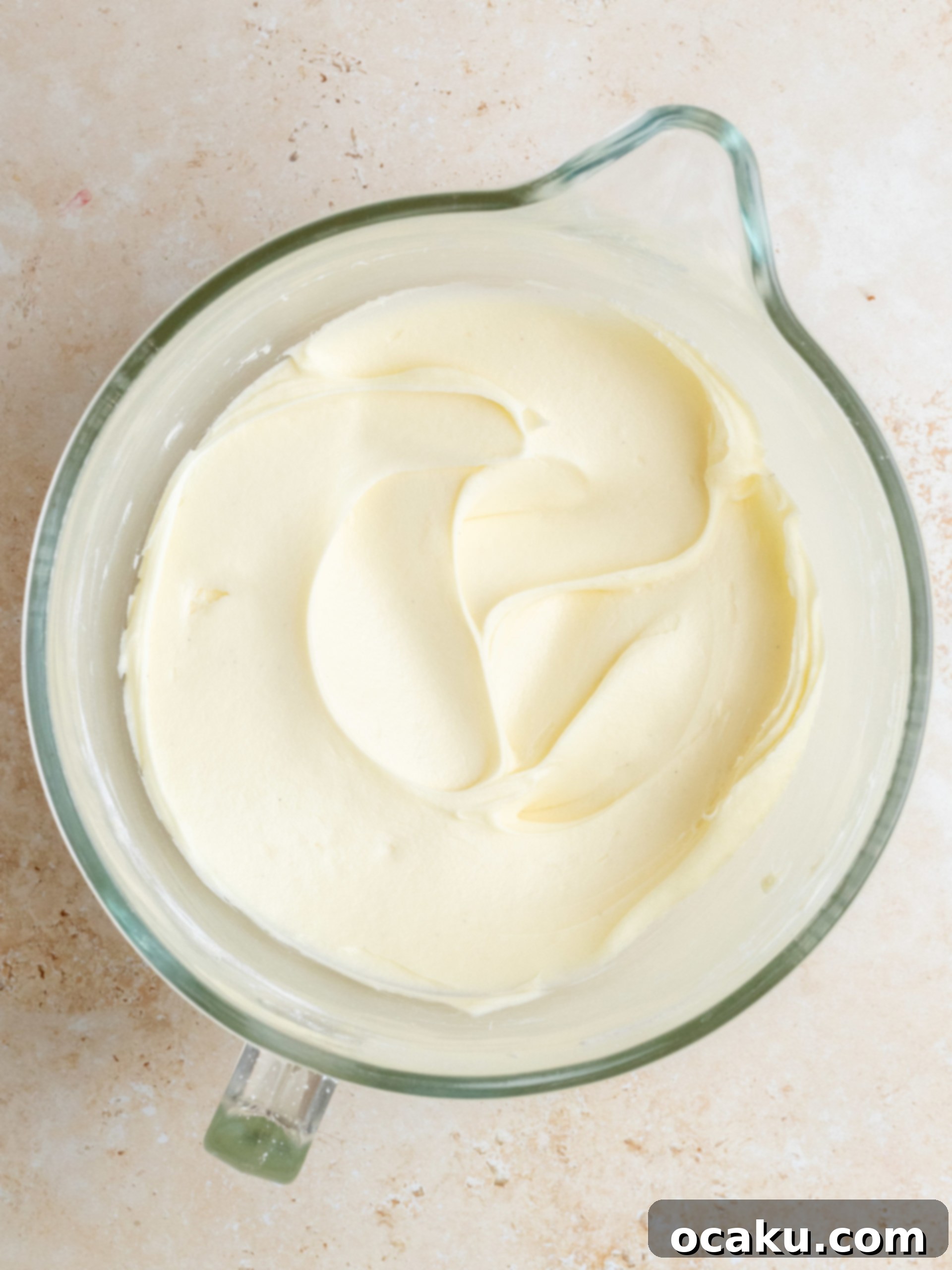 Ultimate Coconut Cloud Cake 7 Decorating a coconut cake with toasted coconut flakes