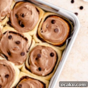 Decadent Nutella Swirls 8 A close-up of a freshly baked Nutella roll, showing its soft texture and generous frosting.