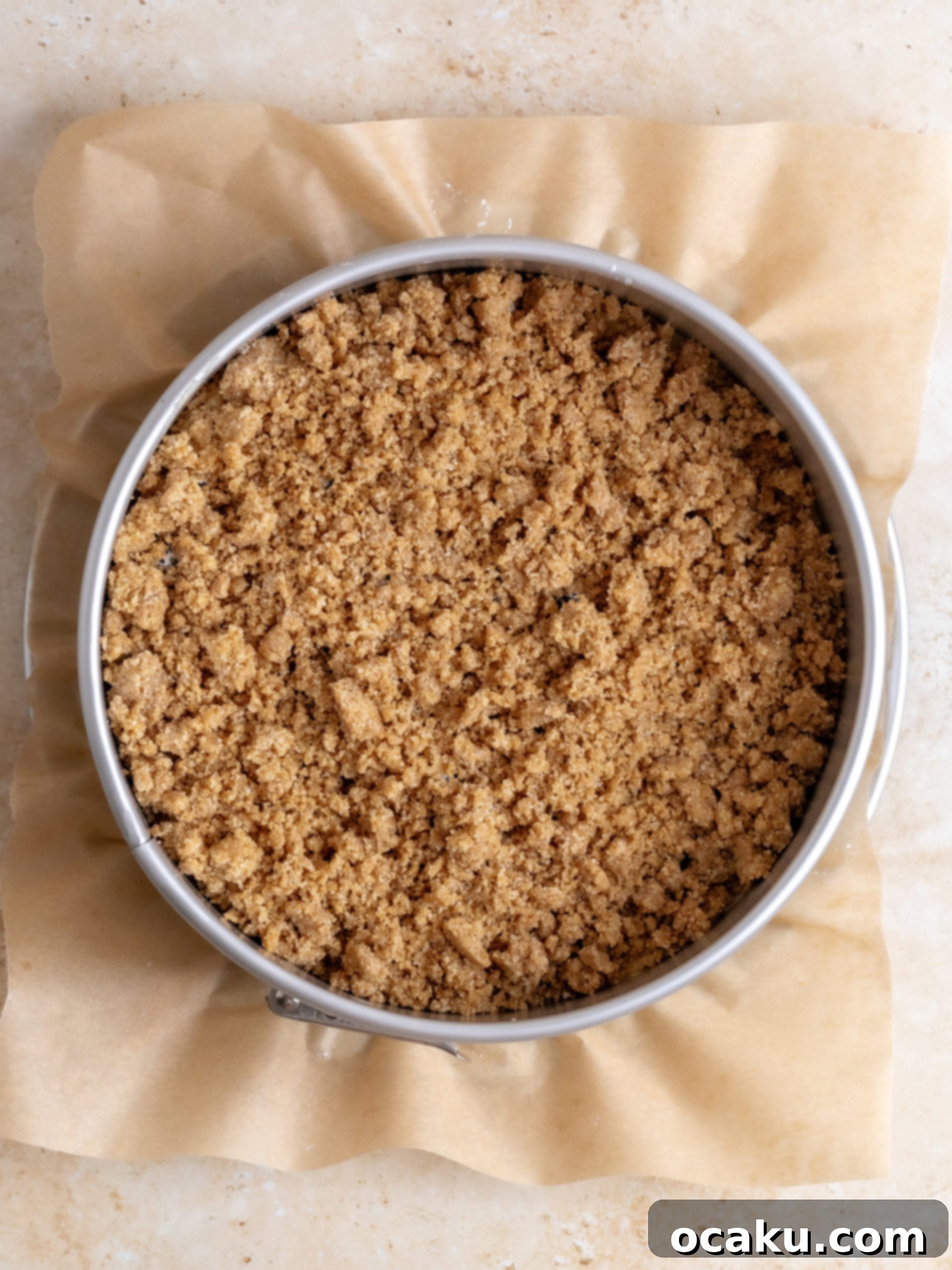 Blueberry coffee cake with crumble topping just out of the oven, golden brown and perfectly baked.