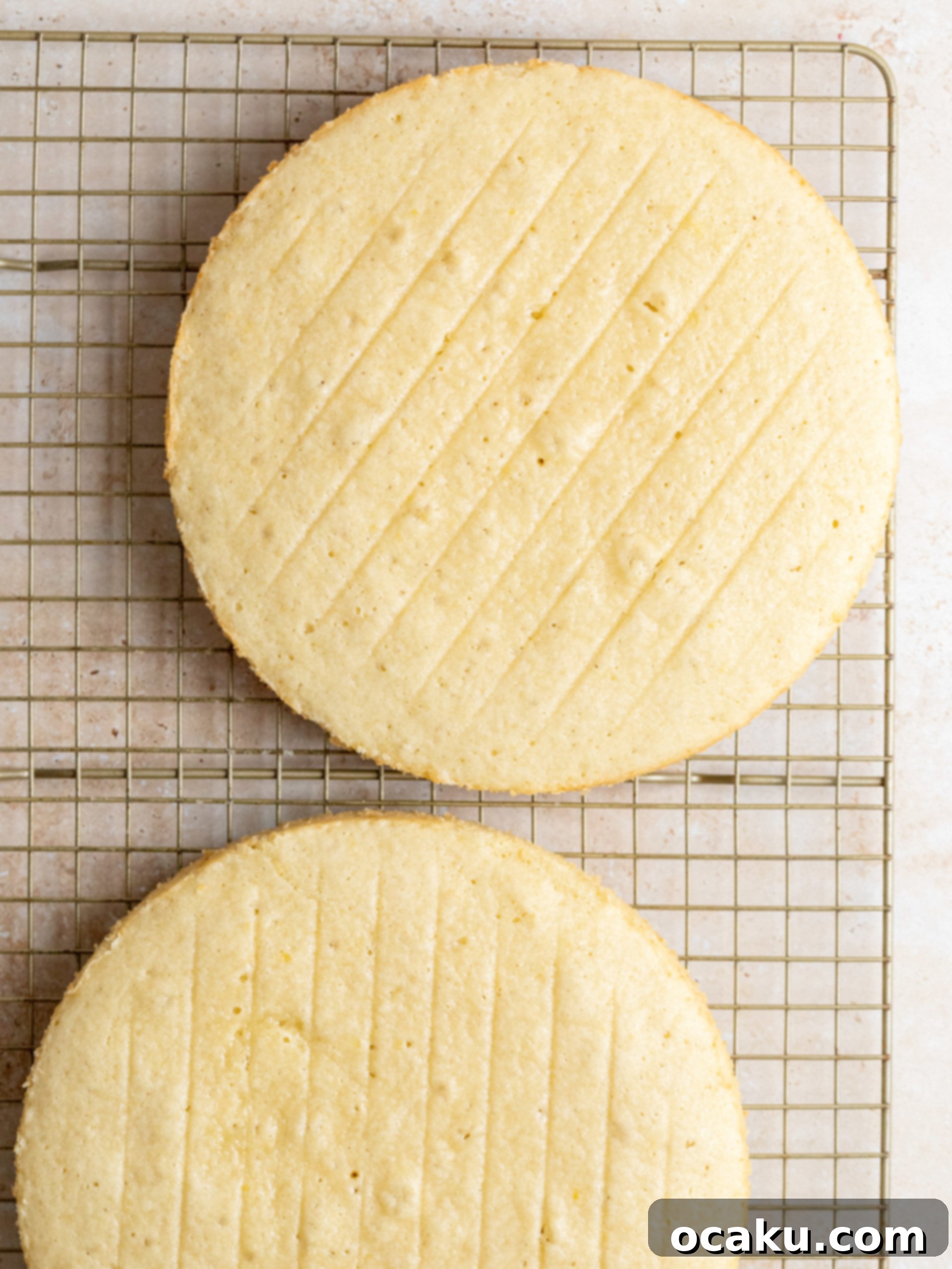 Three cake pans filled with batter, ready for baking.