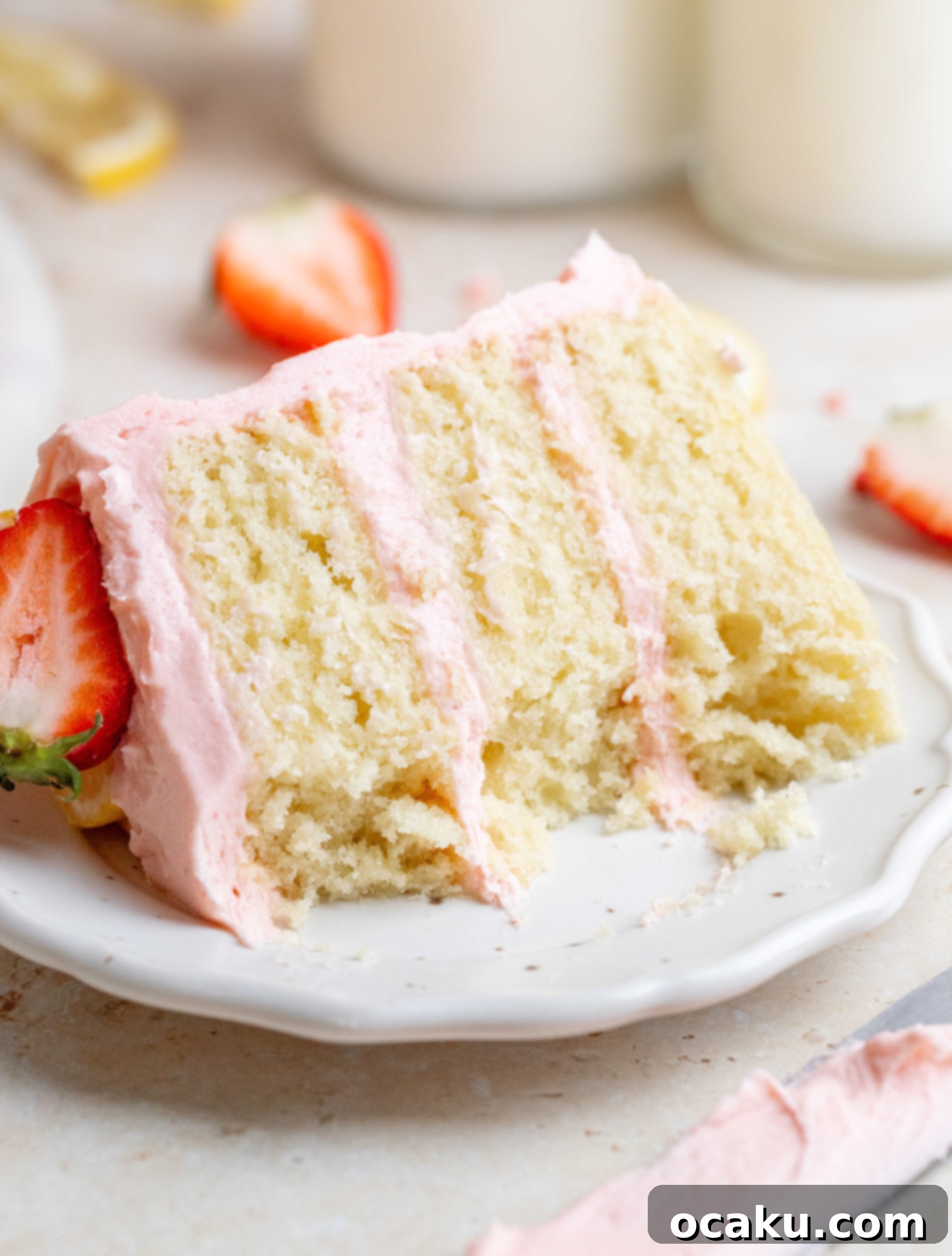 Close-up of a slice of strawberry lemon cake on a plate.