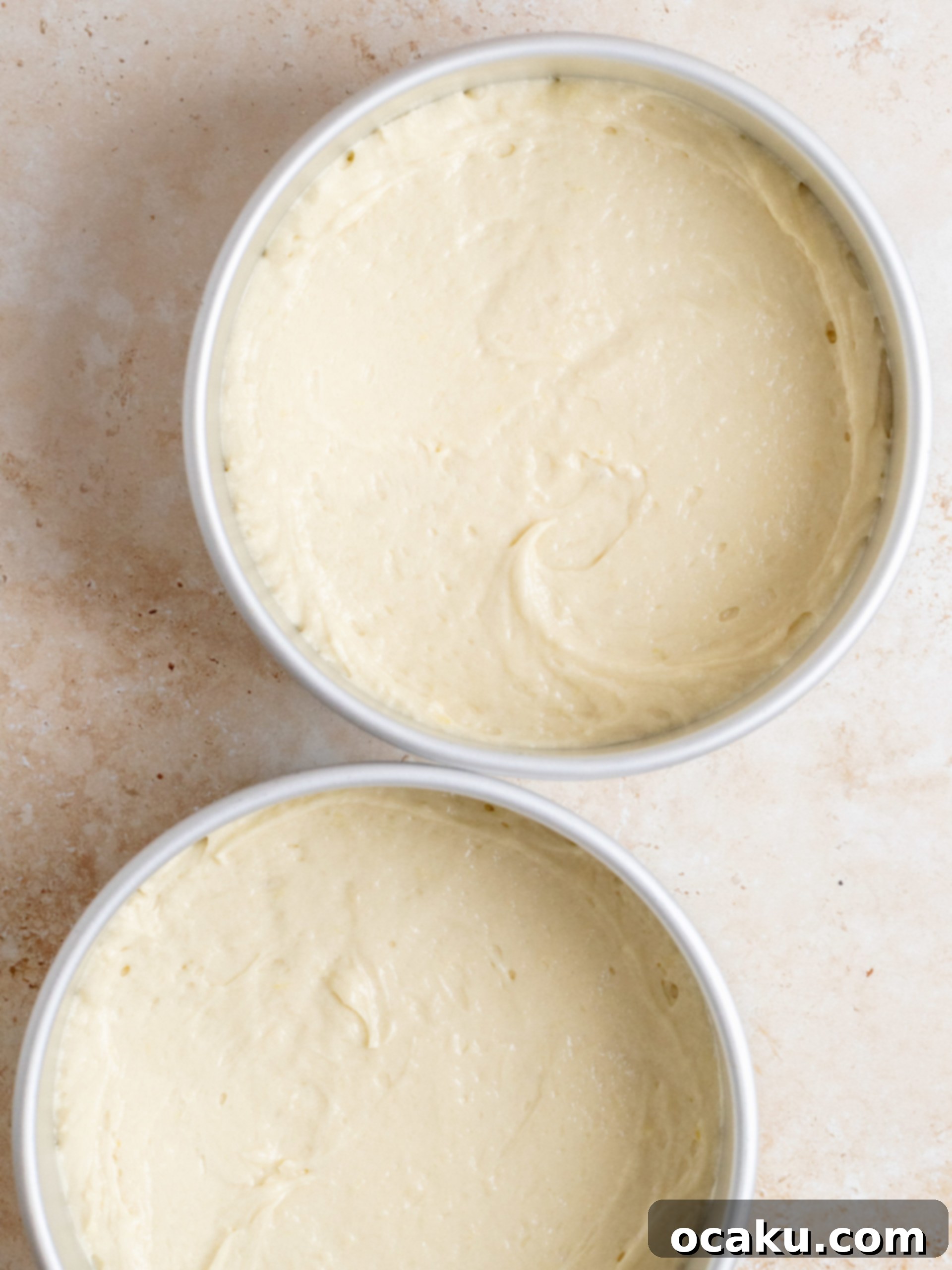 Close-up of creamed butter and lemon sugar mixture in a stand mixer.