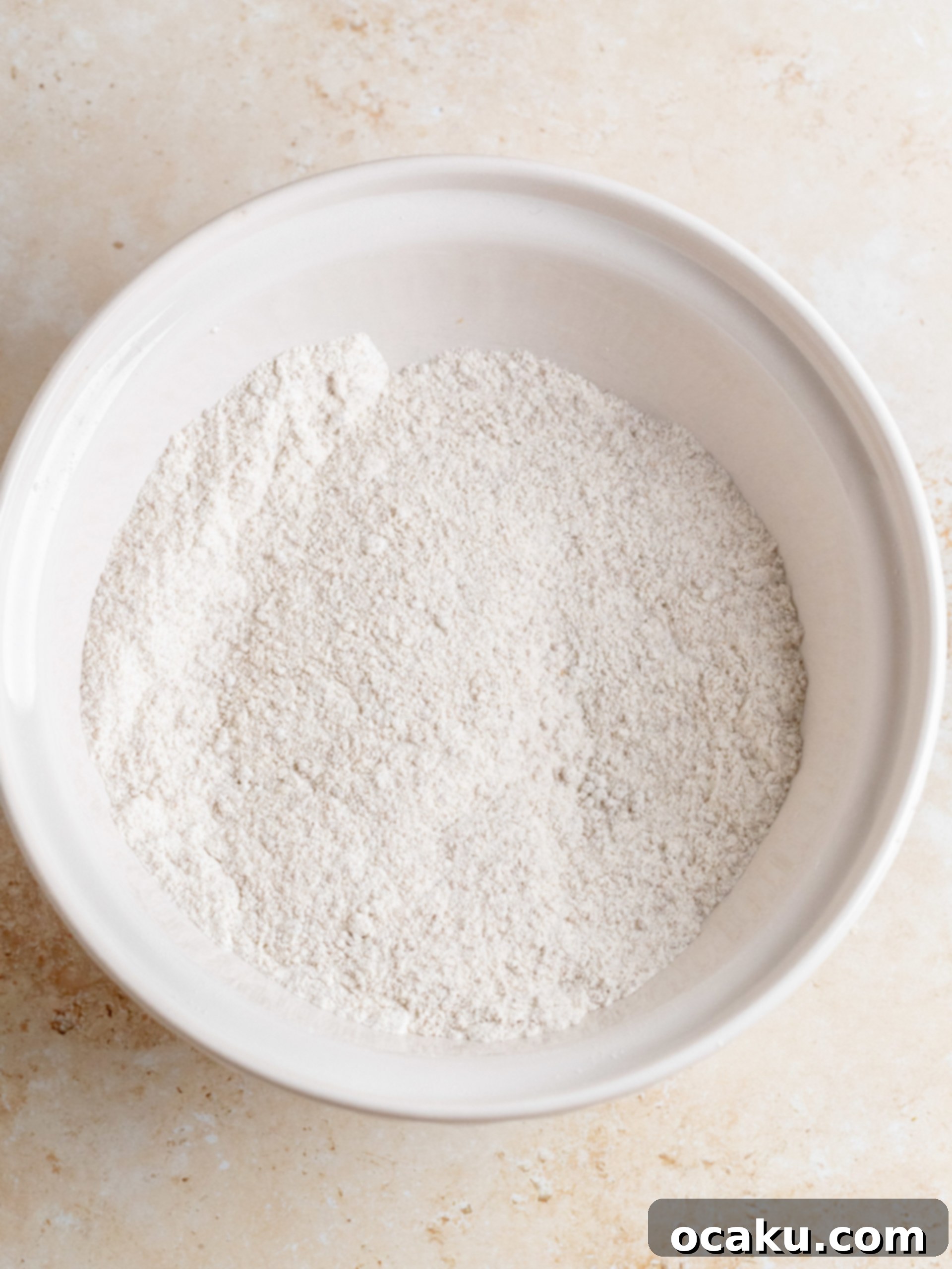 Adding grated carrots to cake batter