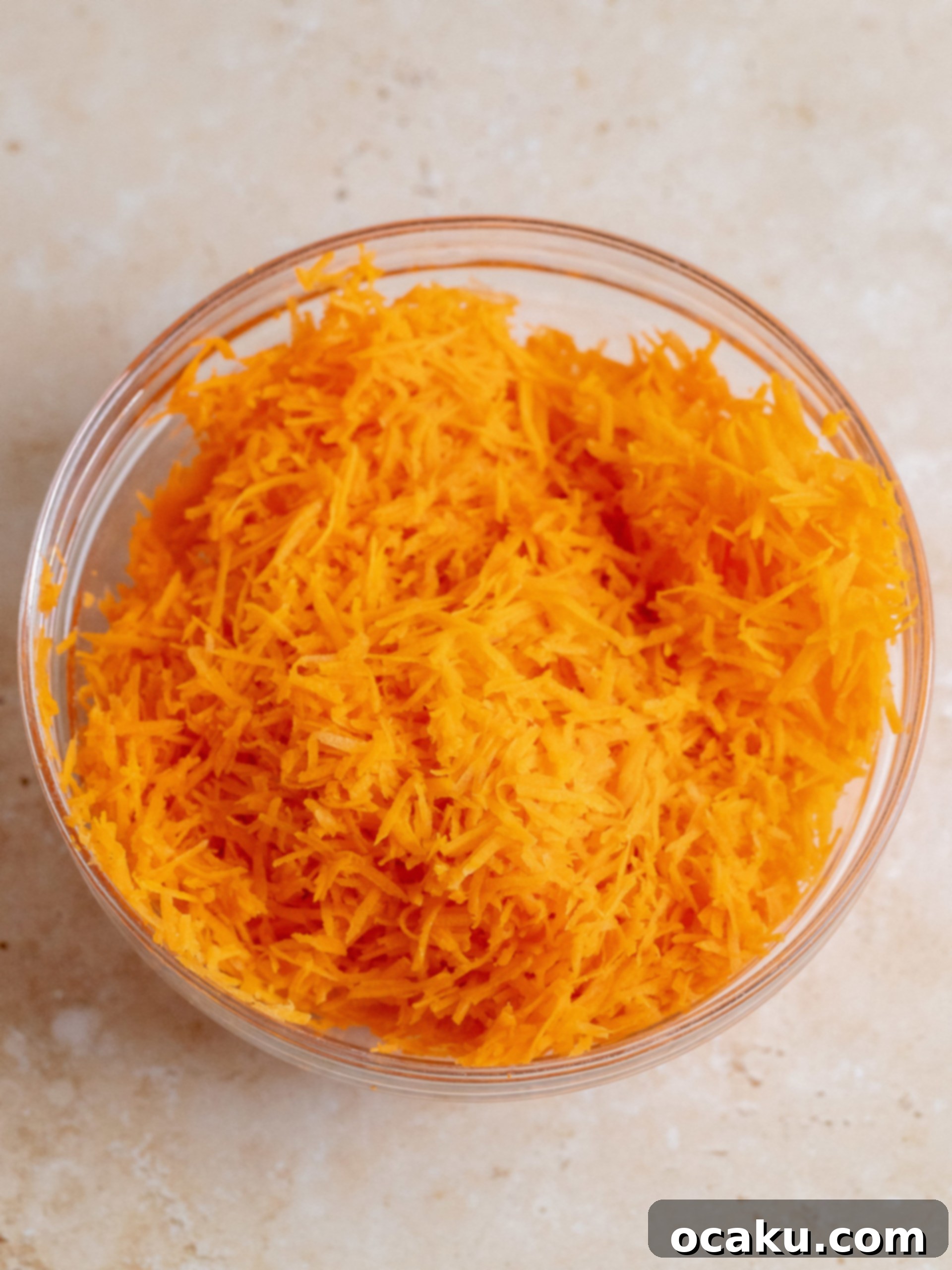 Pouring cake batter into baking pans