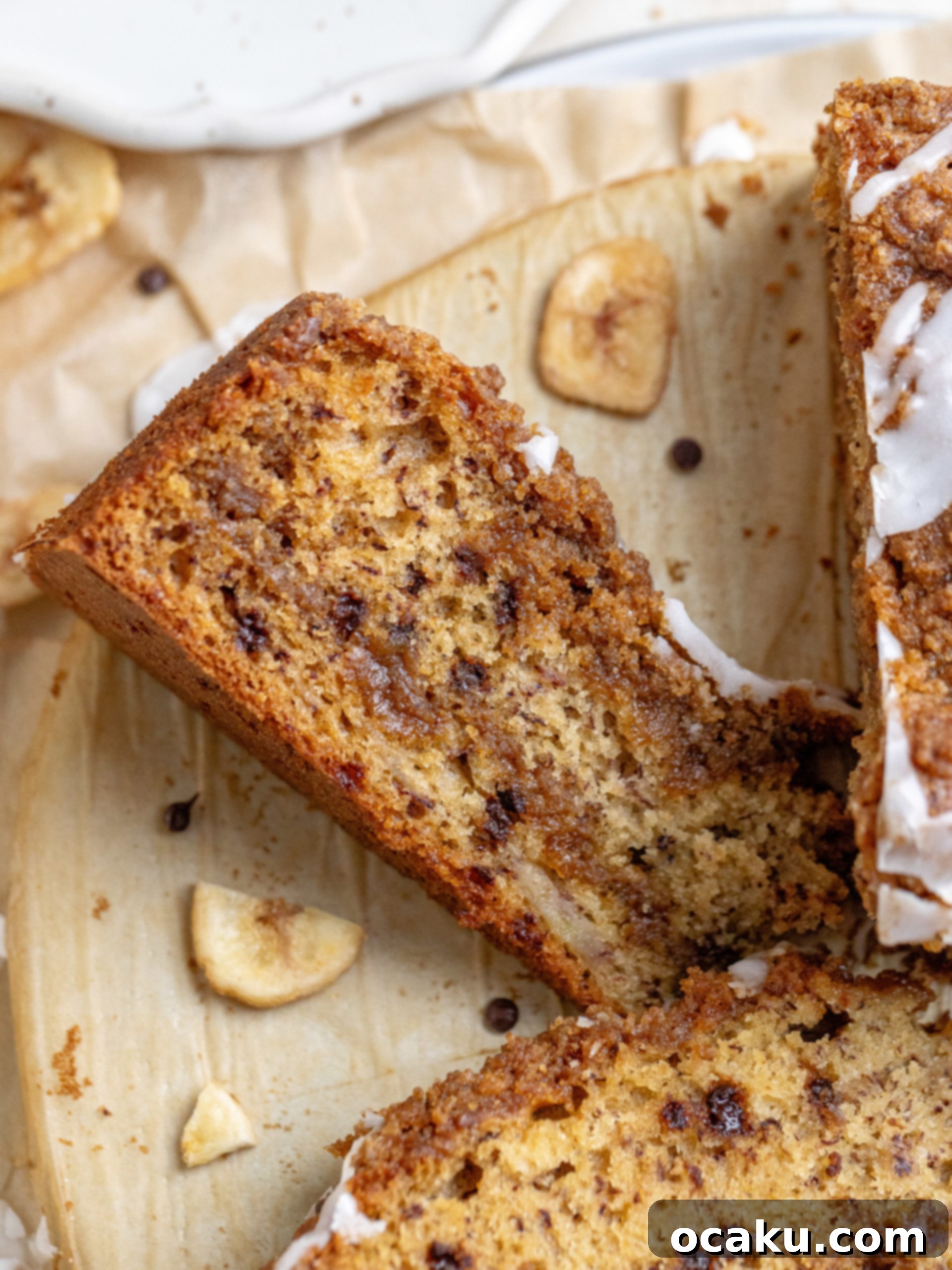 Brown Butter Banana Coffee Cake slice with streusel topping and vanilla glaze