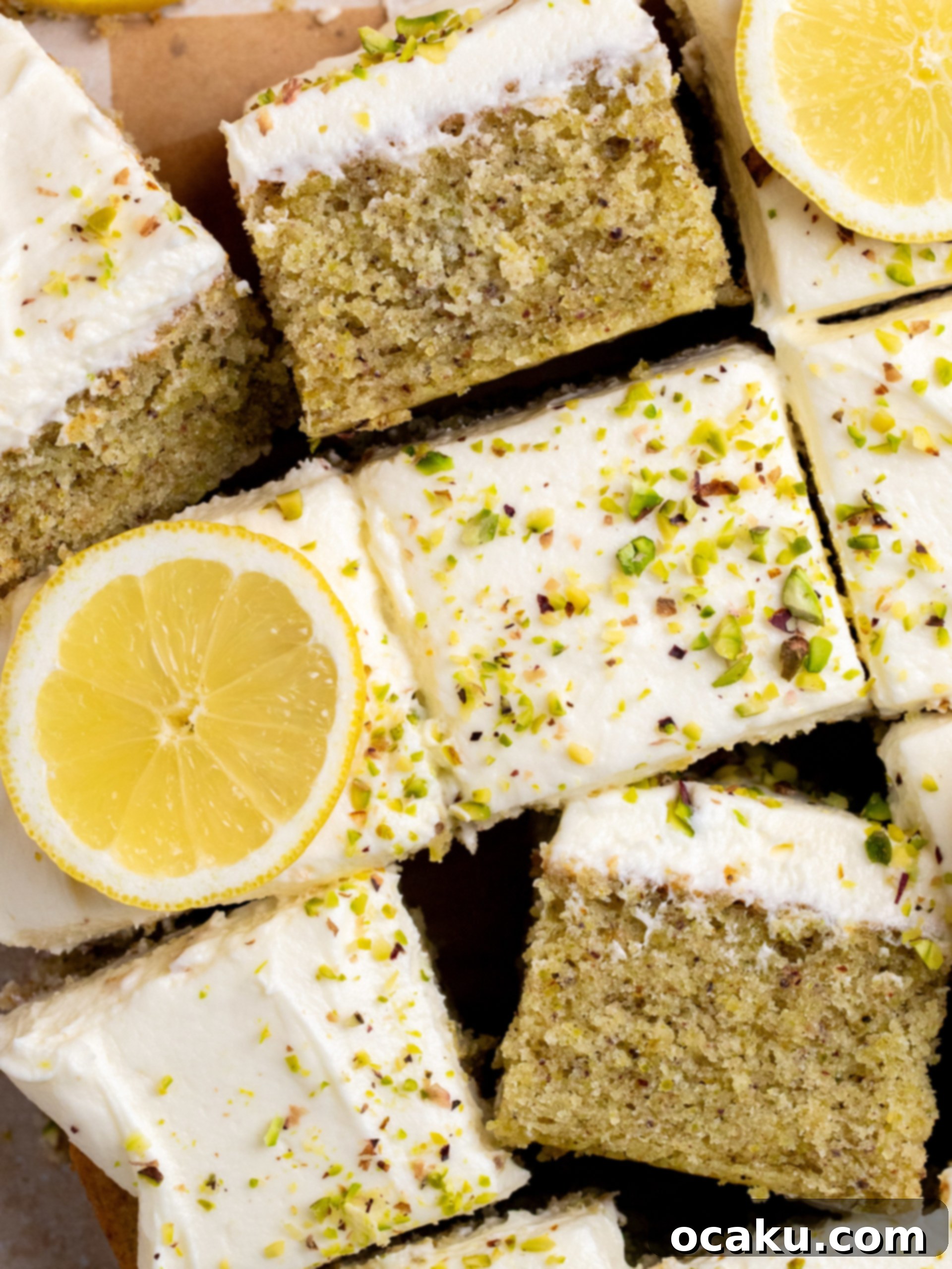 Zesty Lemon Pistachio Cake 2 A beautifully frosted lemon pistachio sheet cake garnished with chopped pistachios, ready to be served.