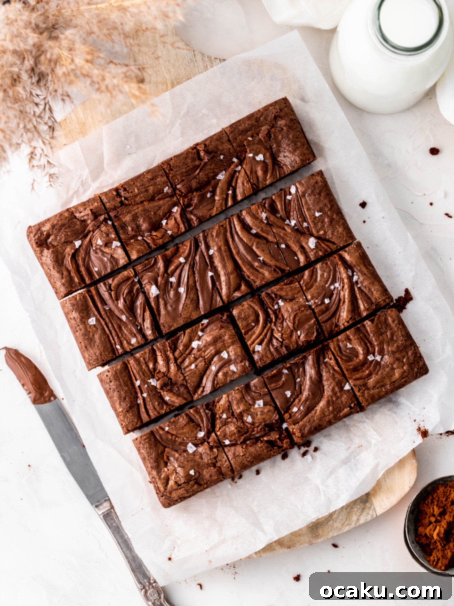 Aperol Spritz Cheesecake Brownie cut into slices.
