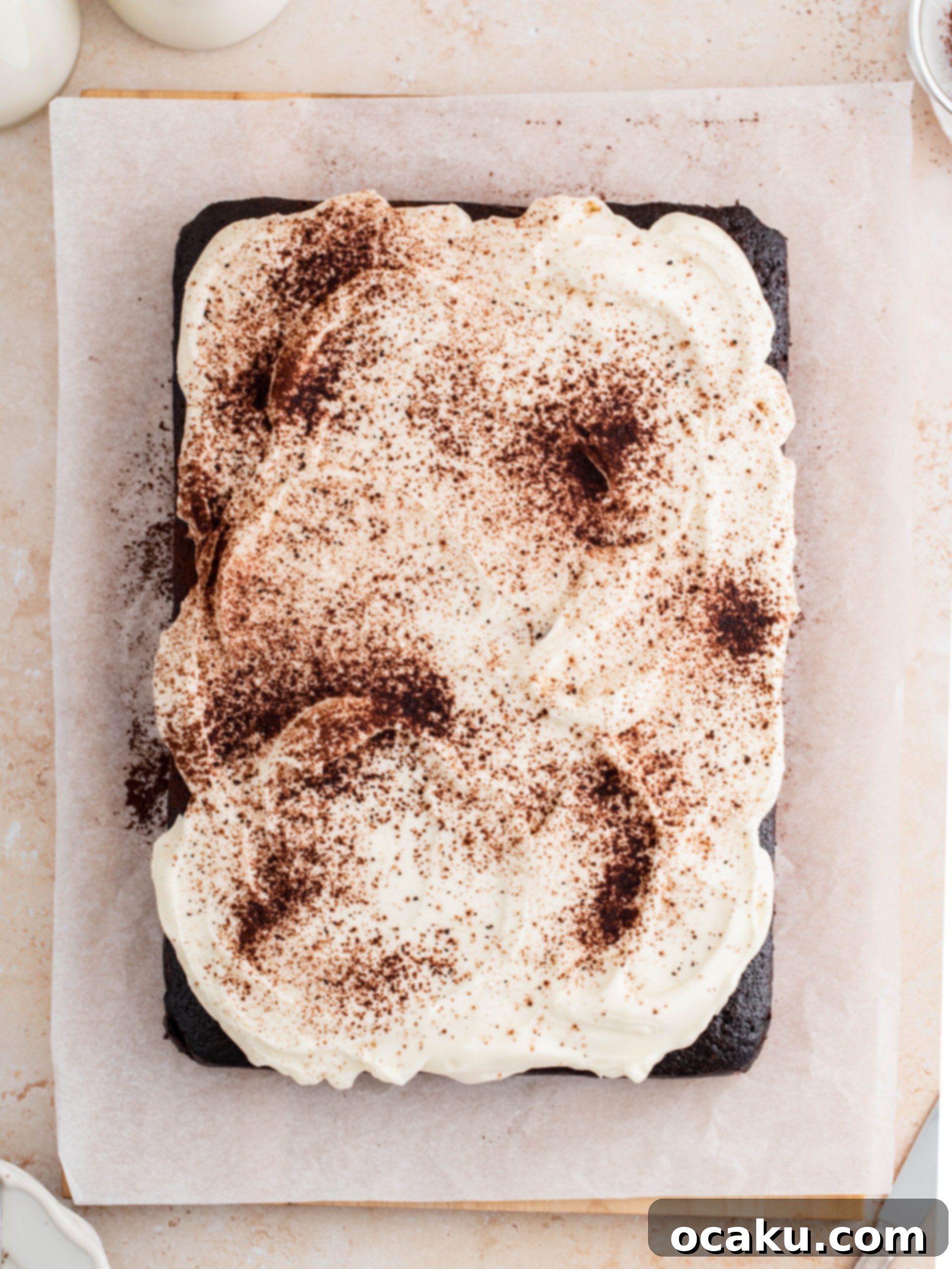 Velvety Chocolate Mascarpone Indulgence 3 The freshly baked chocolate mascarpone cake on a cutting board, ready to be sliced.