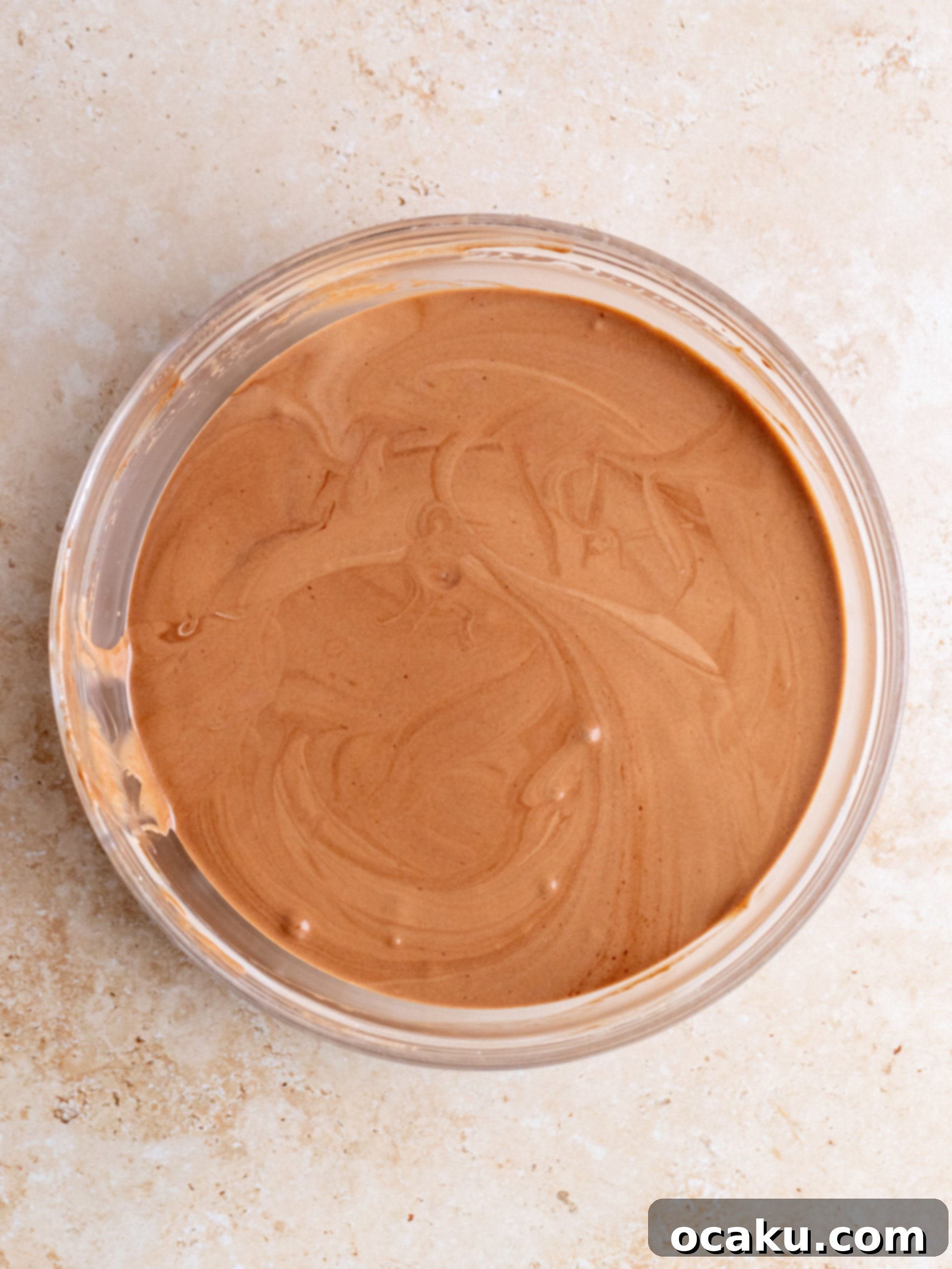 Folding whipped cream into chocolate mixture for mousse.