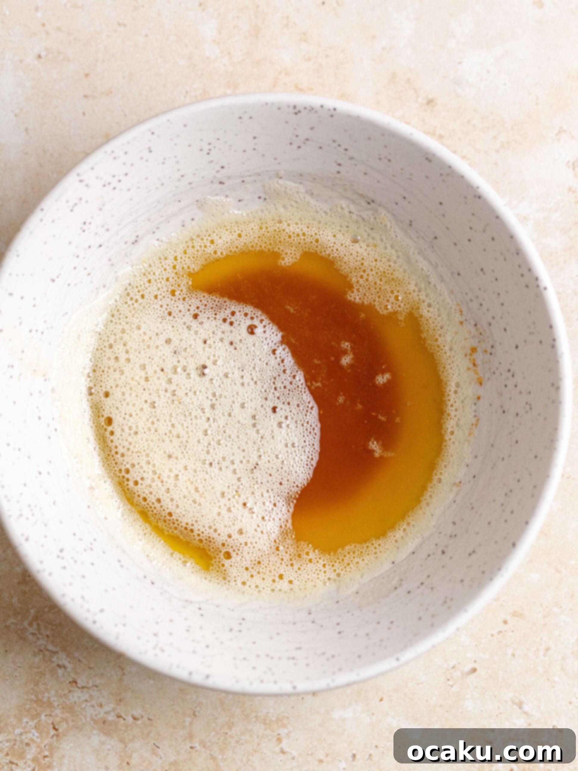 Butter melting and beginning to foam in a cast iron skillet over medium heat.