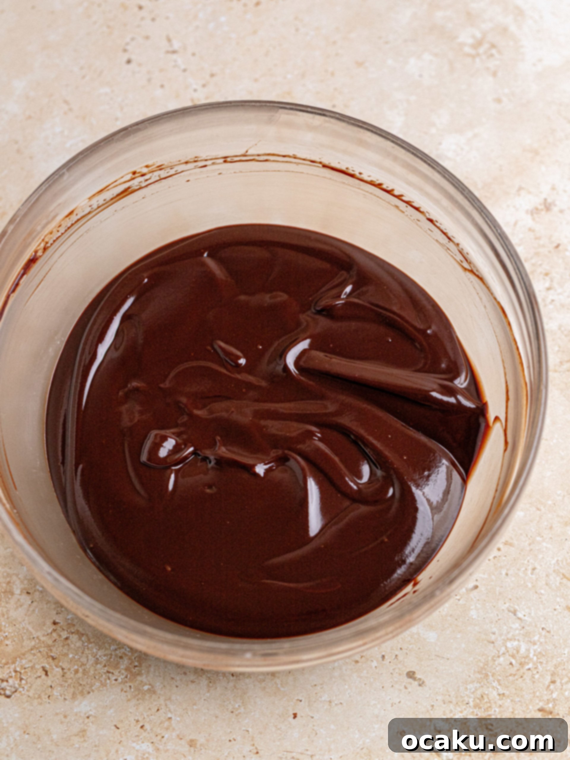 Decadent Chocolate Cheesecake 5 Oreo cookie crust meticulously pressed into a springform pan, ready for the oven.