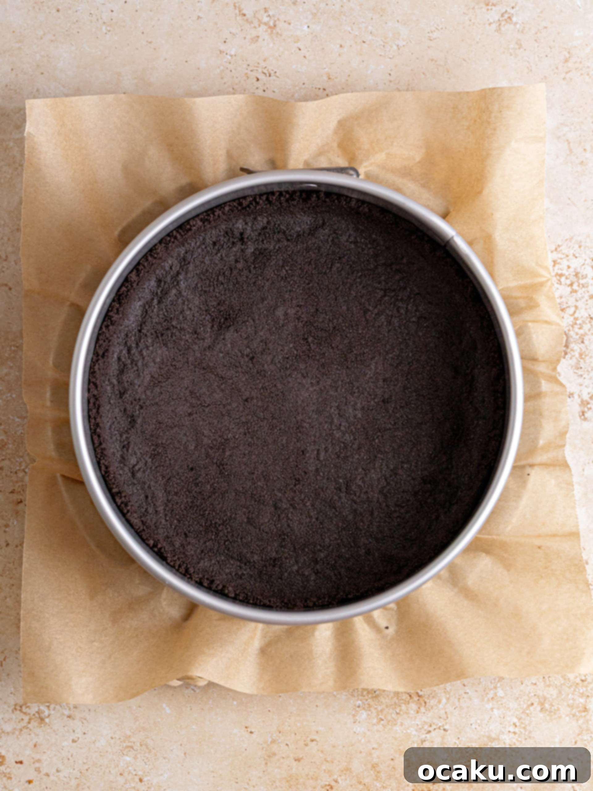 Decadent Chocolate Cheesecake 6 Cream cheese and sugar being creamed together in a stand mixer, demonstrating proper mixing technique.