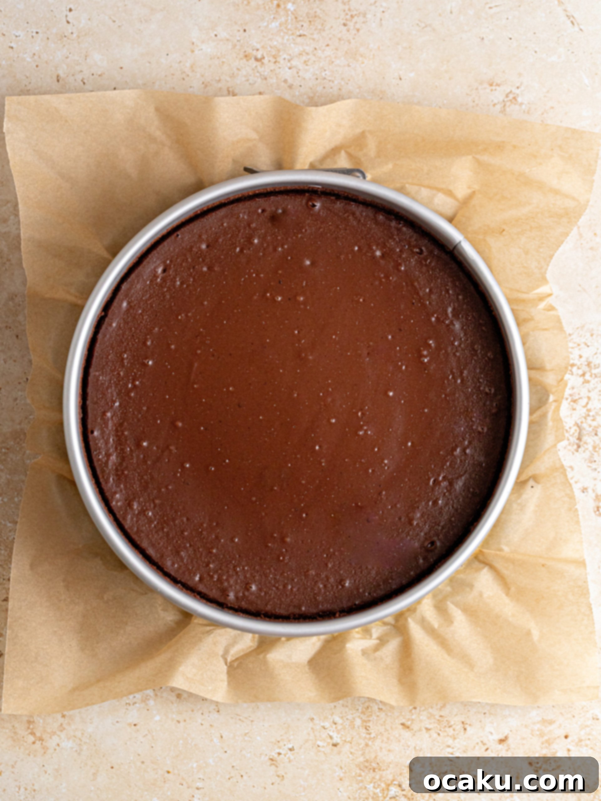 Decadent Chocolate Cheesecake 9 Chocolate cheesecake baking gently in a water bath inside the oven, a crucial step for preventing cracks.