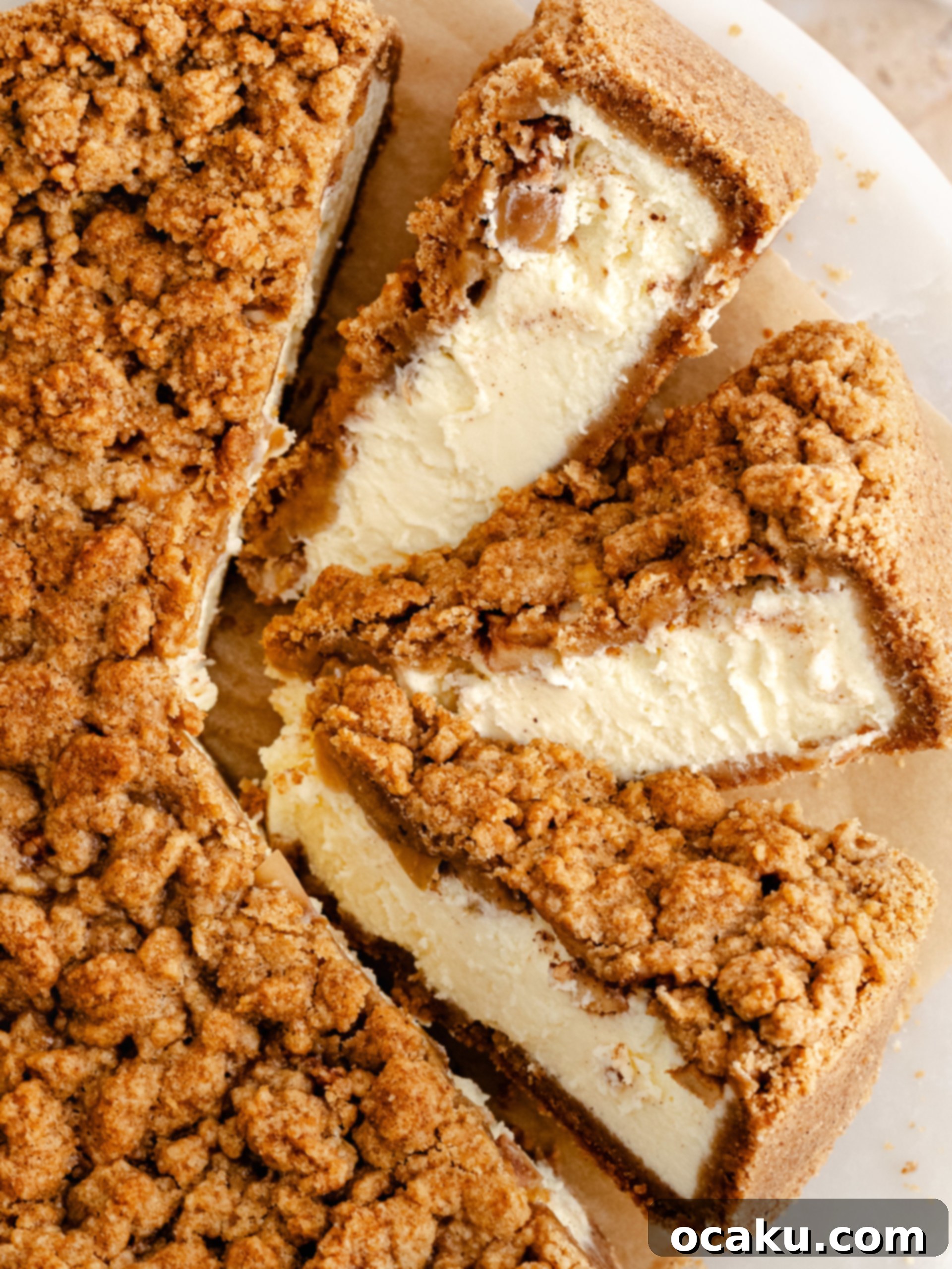 A beautifully baked Apple Crumble Cheesecake, cooling on a wire rack.