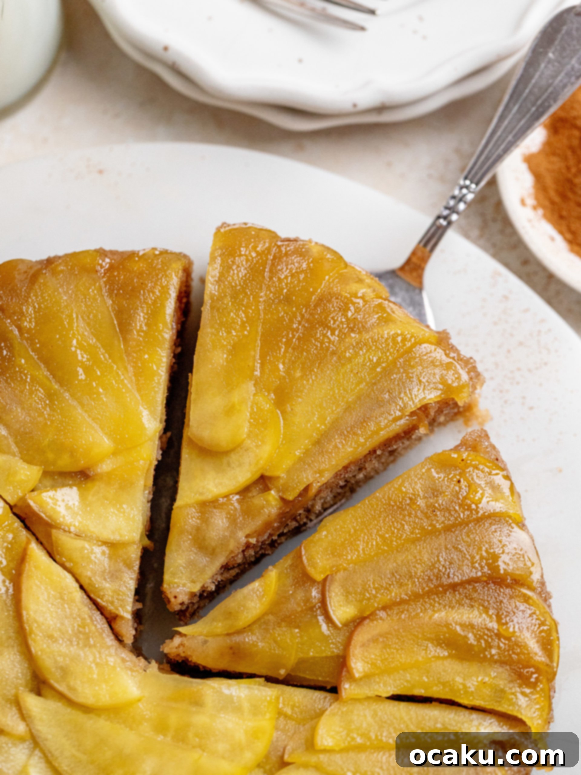 Slice of Maple Apple Upside Down Cake with whipped cream