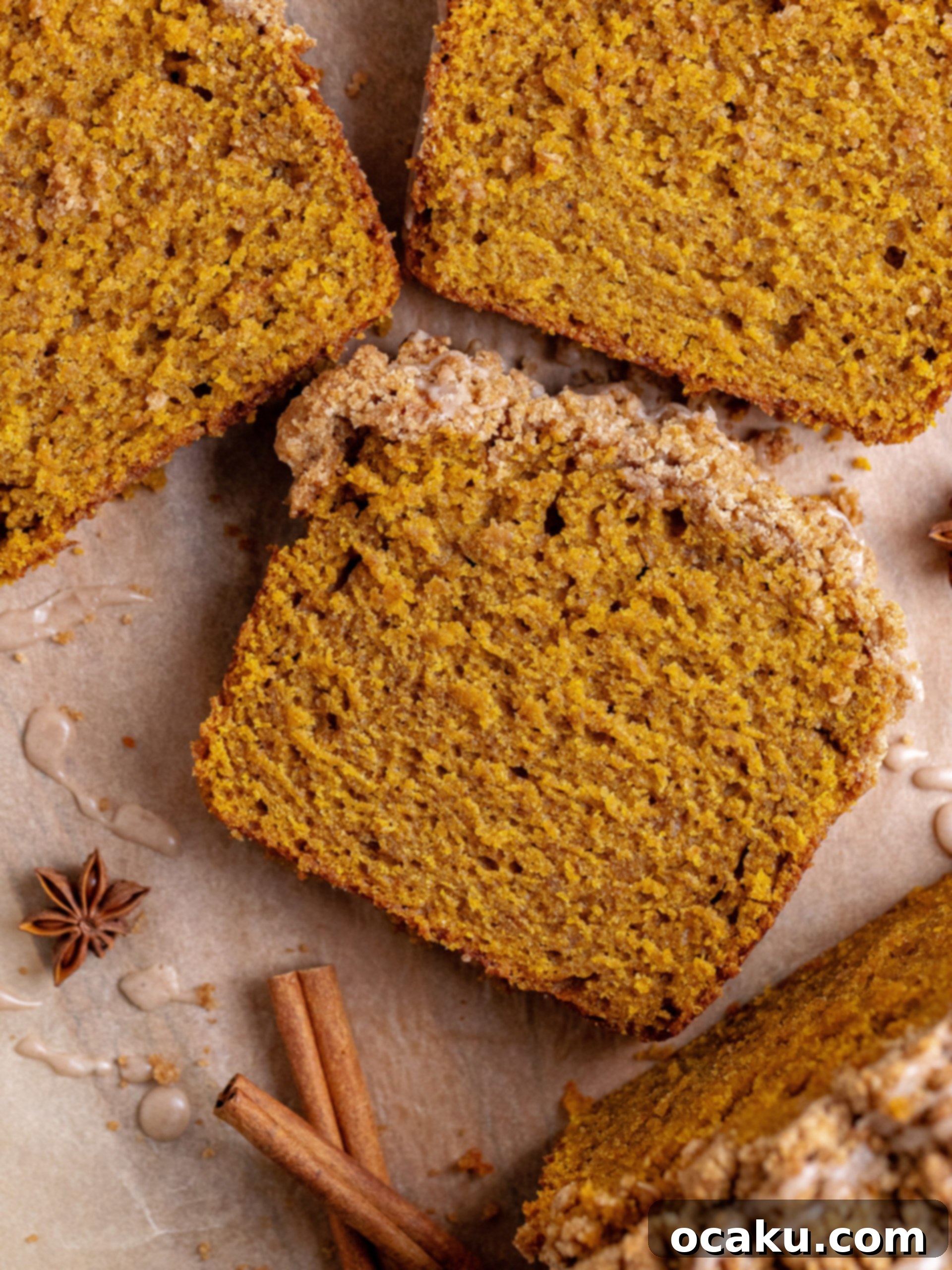 Pumpkin Perfection Loaf with Crumbly Topping and Spice Drizzle 2 A slice of incredibly moist pumpkin bread with a golden streusel topping and a drizzle of pumpkin spice glaze, set against a cozy autumn backdrop.