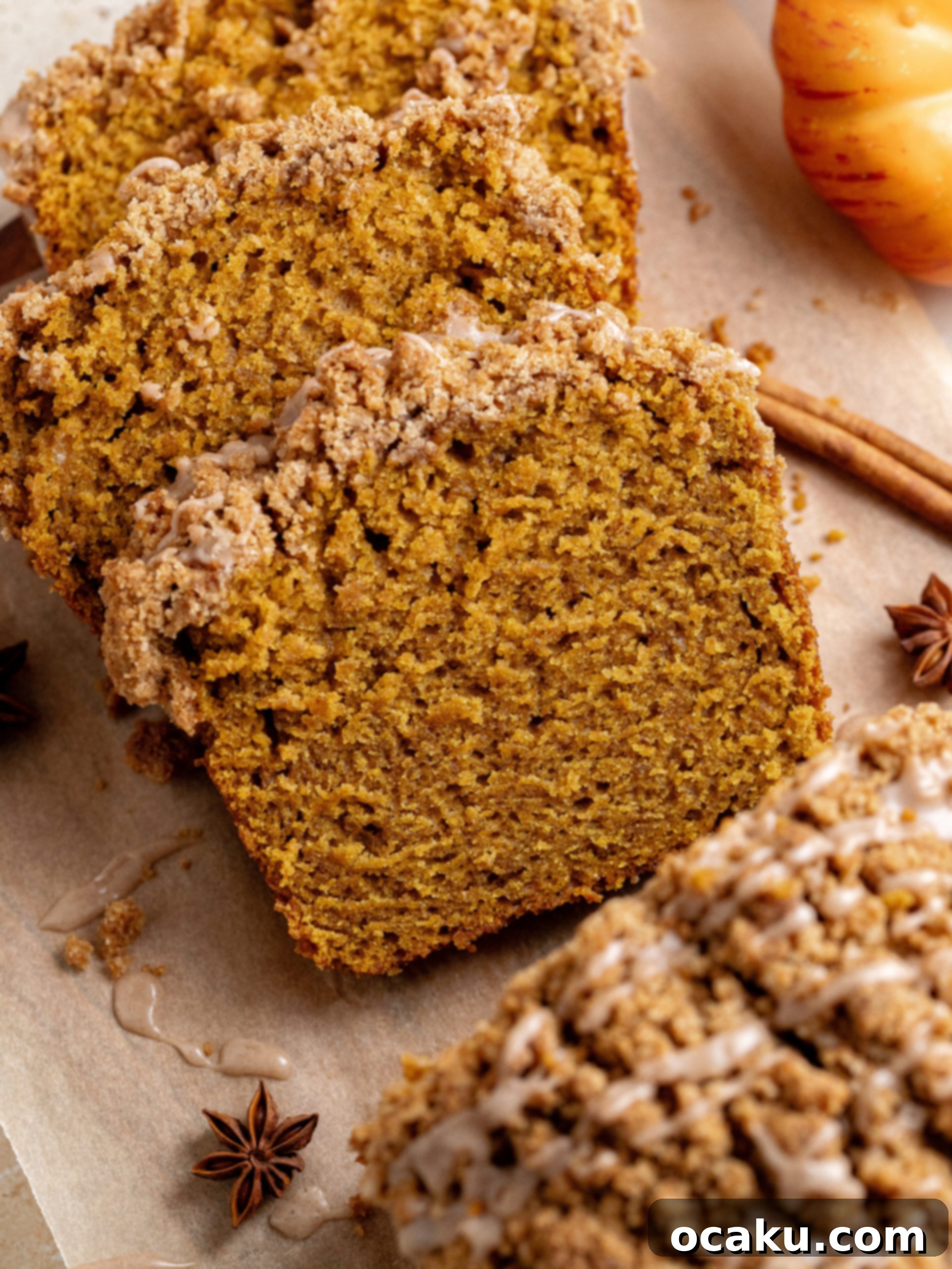 Pumpkin Perfection Loaf with Crumbly Topping and Spice Drizzle 3 Close-up of the streusel topping on baked pumpkin bread, showing the golden brown crumbs and moist texture underneath.