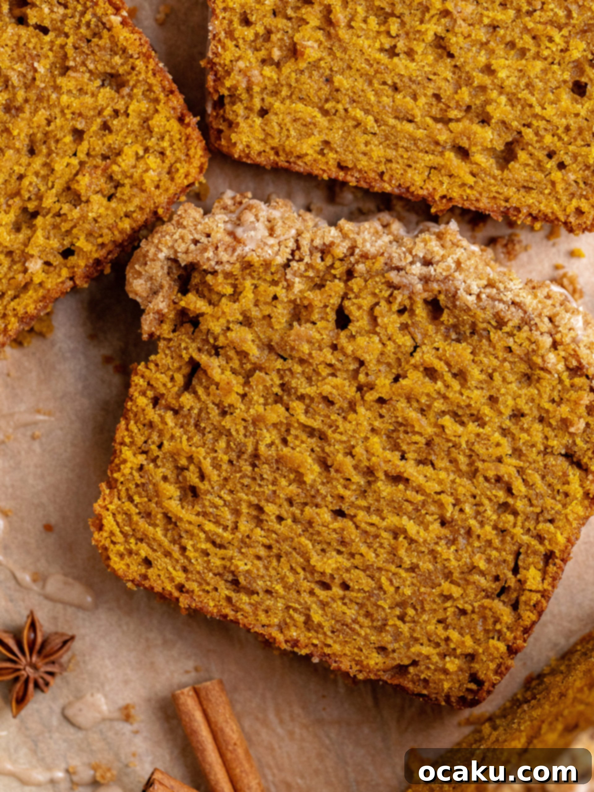 Pumpkin Perfection Loaf with Crumbly Topping and Spice Drizzle 6 Freshly baked pumpkin bread cooling on a wire rack, ready for the glaze.