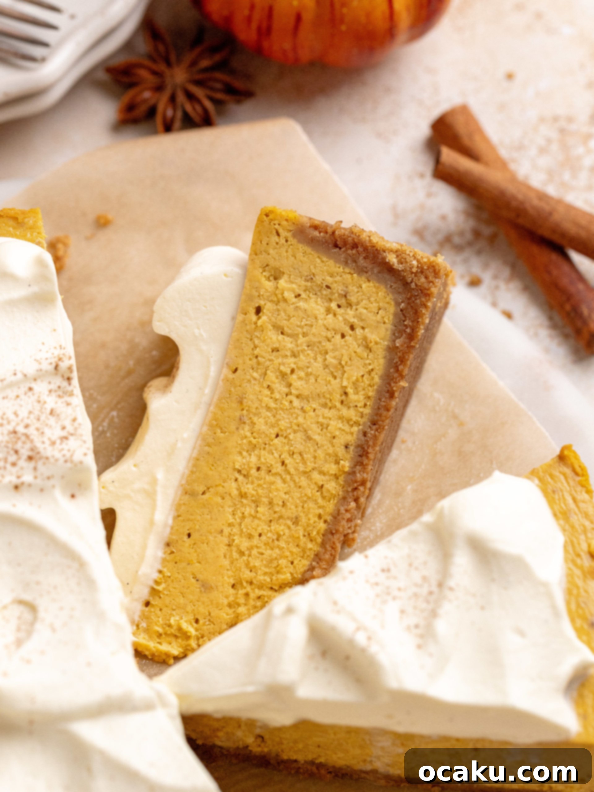 A delectable slice of pumpkin cheesecake, showing off its rich filling and perfect crust texture.