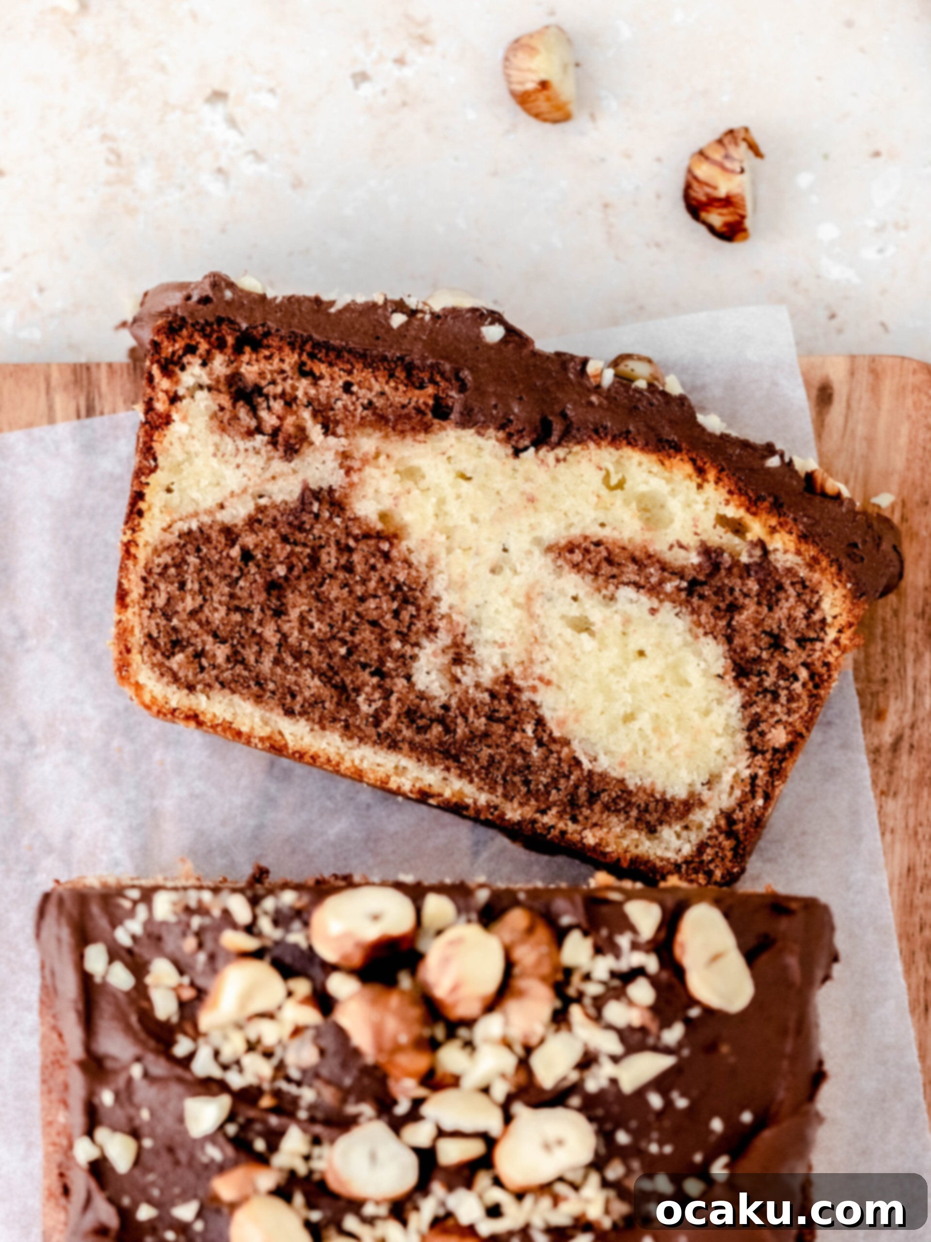 Close-up of a marbled Nutella loaf cake cooling on a wire rack, highlighting its golden-brown crust and enticing texture, with visible swirls.