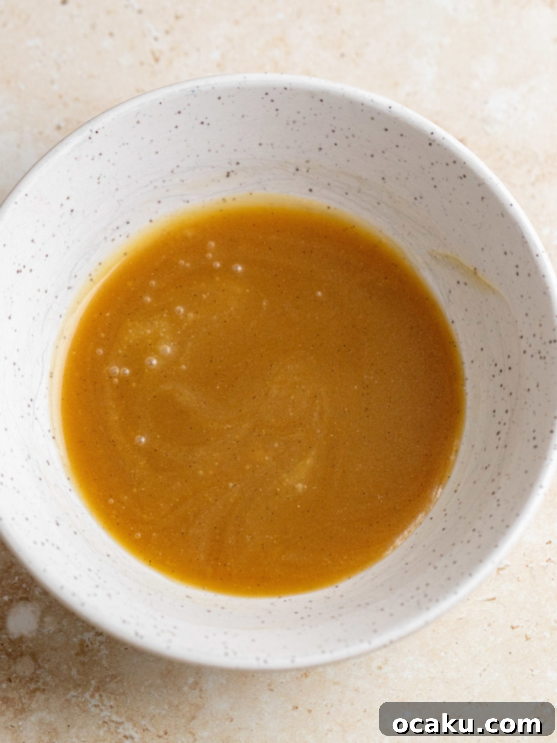 Maple Caramel Pumpkin Cake with Whipped Cream Cheese 7 A finished brown butter pumpkin cake generously frosted with whipped cream cheese and drizzled with maple caramel.