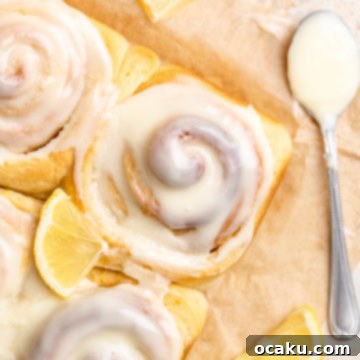 Close-up of a frosted lemon roll.