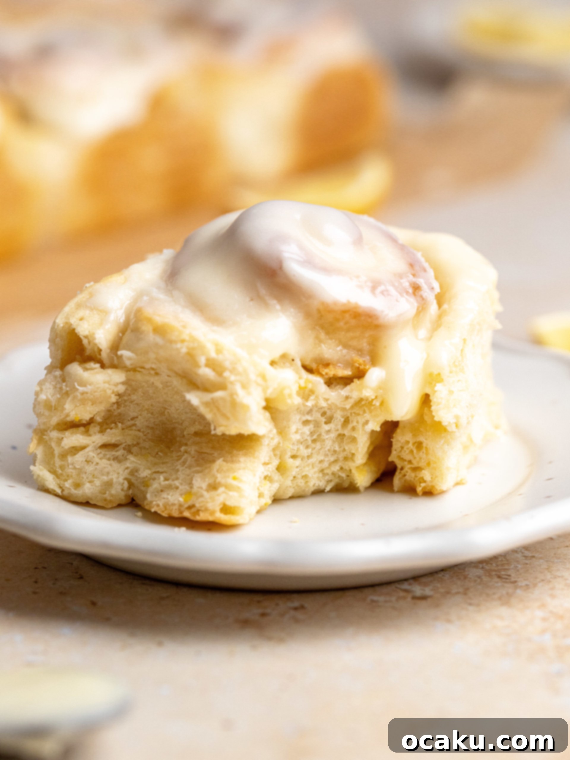 Close-up of a lemon roll showing the soft dough and lemon sugar swirl.