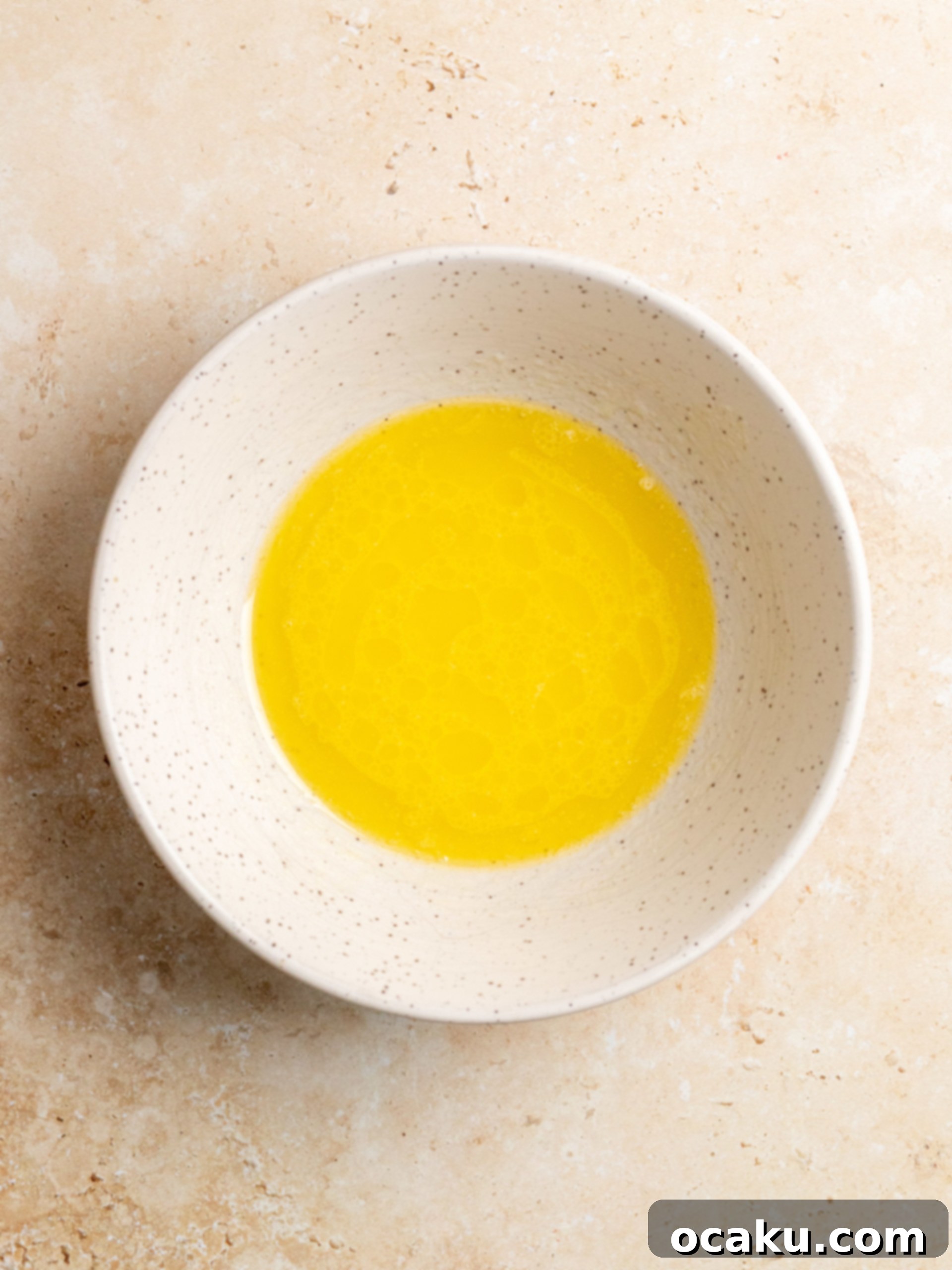 Dough in a bowl, covered for rising.