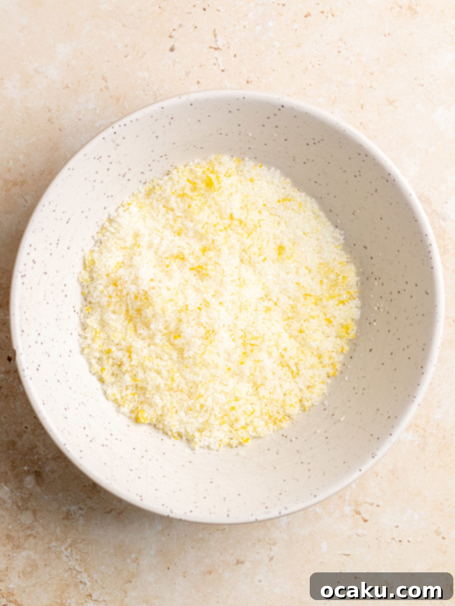 Dough being rolled out on a floured surface.