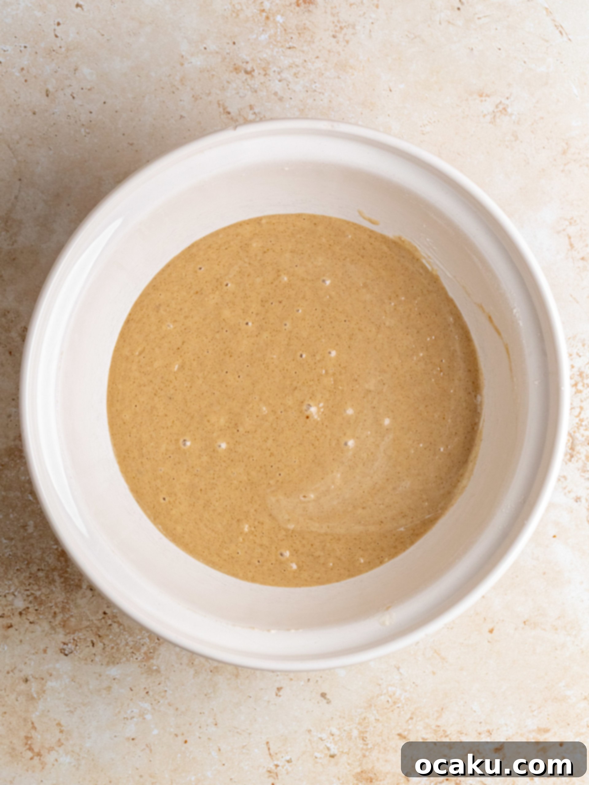 Step-by-step image of combining wet and dry ingredients.